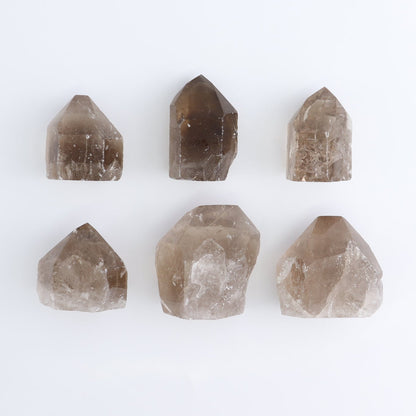 Smoky Quartz Polished Tops Set of 35 - Expert Wholesale and Supplier of Wholesale Crystals & Bulk Gemstones, ["Brazil","Points","Polished Tip","Quartz","Smoky Quartz"]