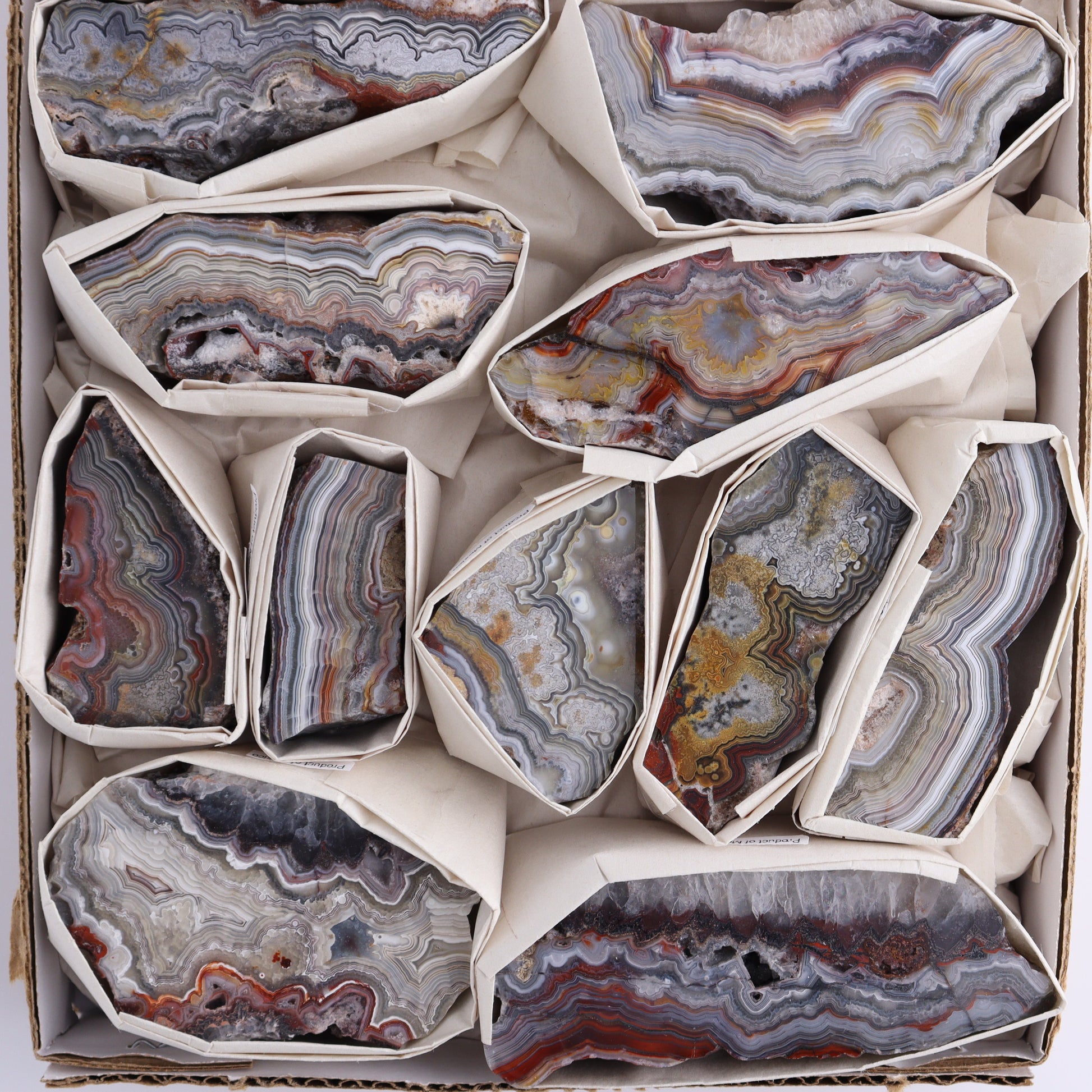 Crazy Lace Agate Flat of 13 - Expert Wholesale and Supplier of Wholesale Crystals & Bulk Gemstones, ["Crazy Lace Agate","Mexico"]