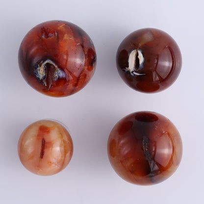 Carnelian Spheres Set of 15 - Expert Wholesale and Supplier of Wholesale Crystals & Bulk Gemstones, ["carnelian","close_30","flames","Madagascar"]