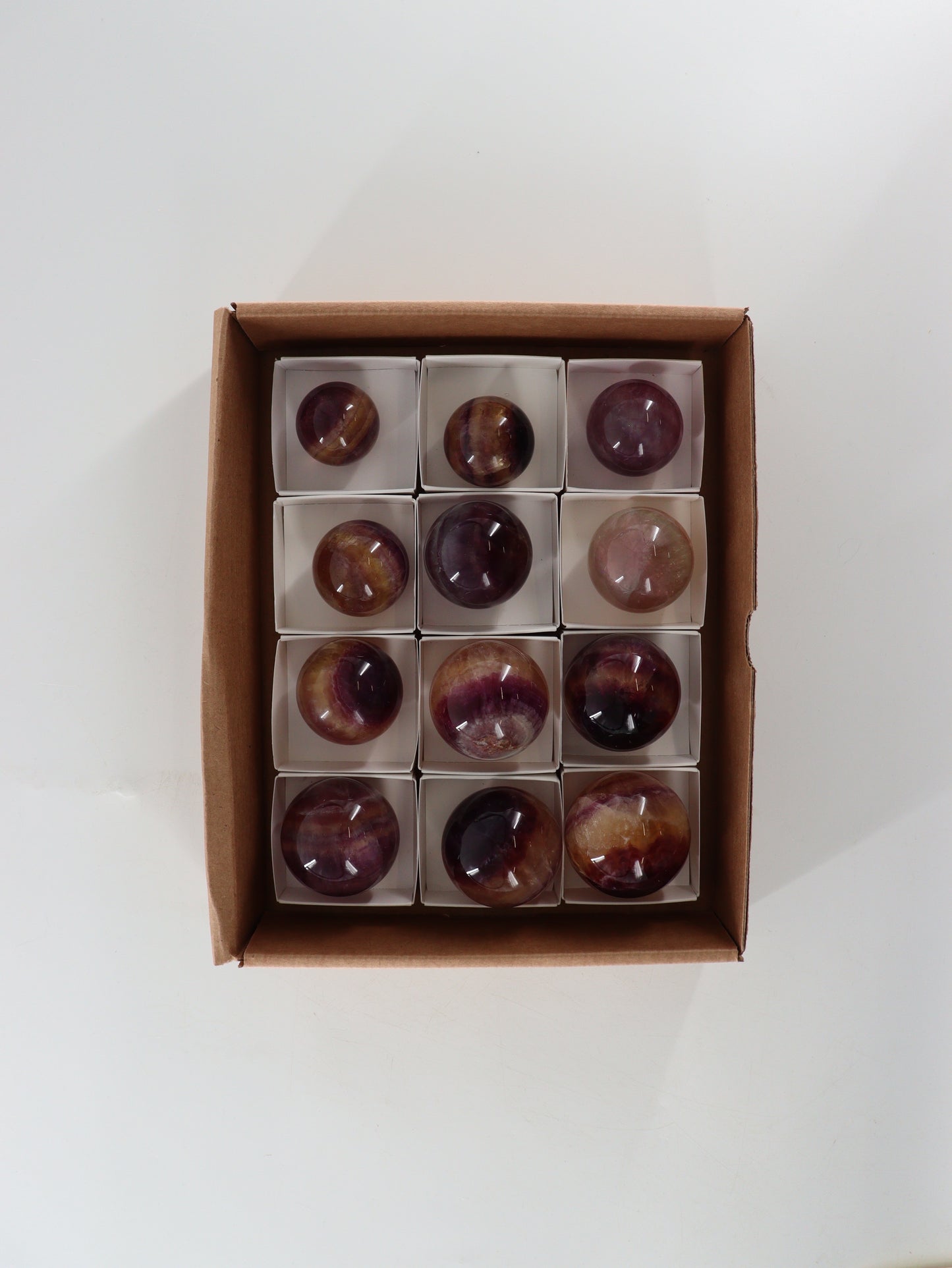 Fluorite Spheres Set of 12 - Expert Wholesale and Supplier of Wholesale Crystals & Bulk Gemstones, []