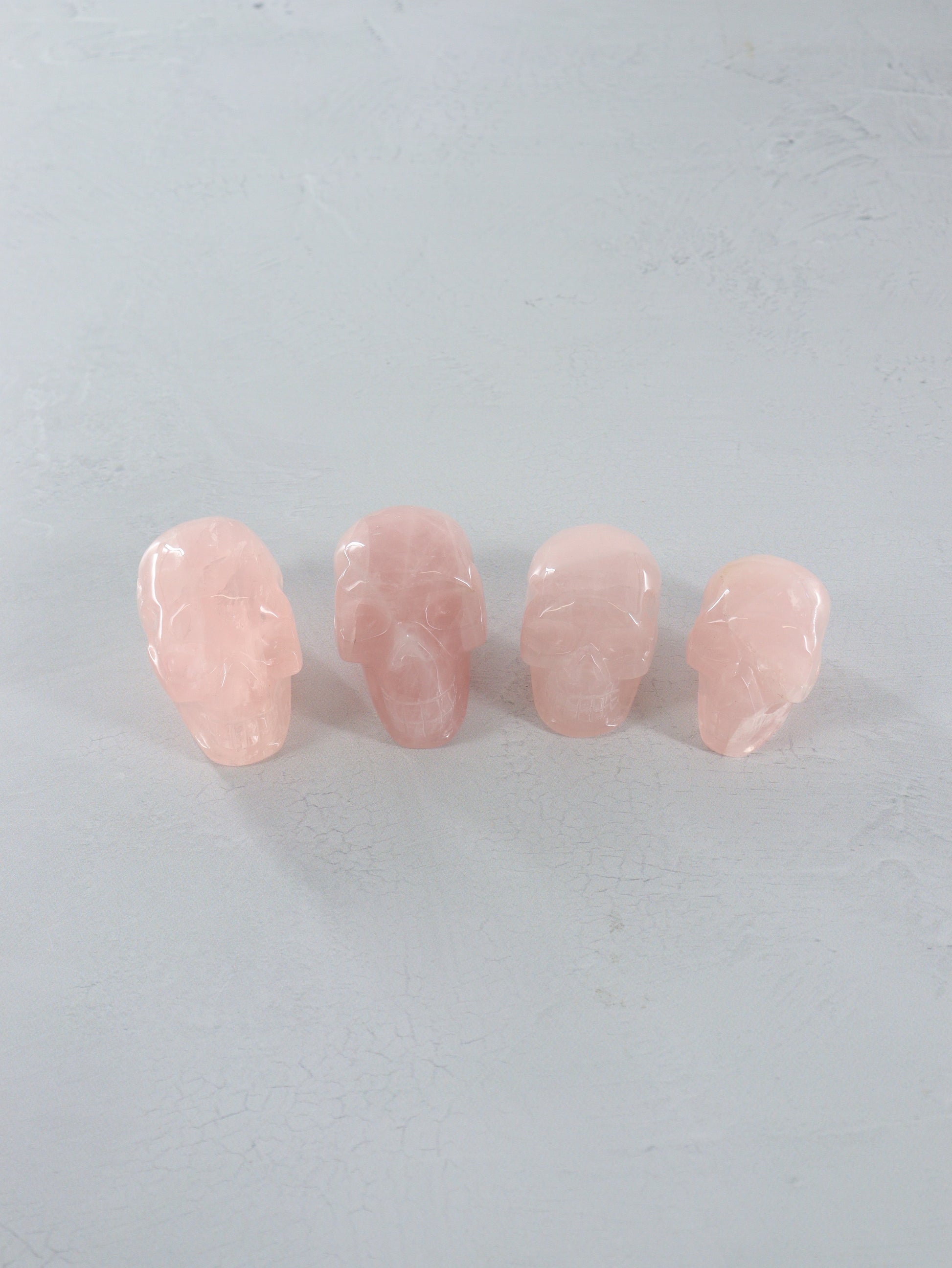 Rose Quartz Skulls Set of 4 - Expert Vendor of Wholesale Crystals