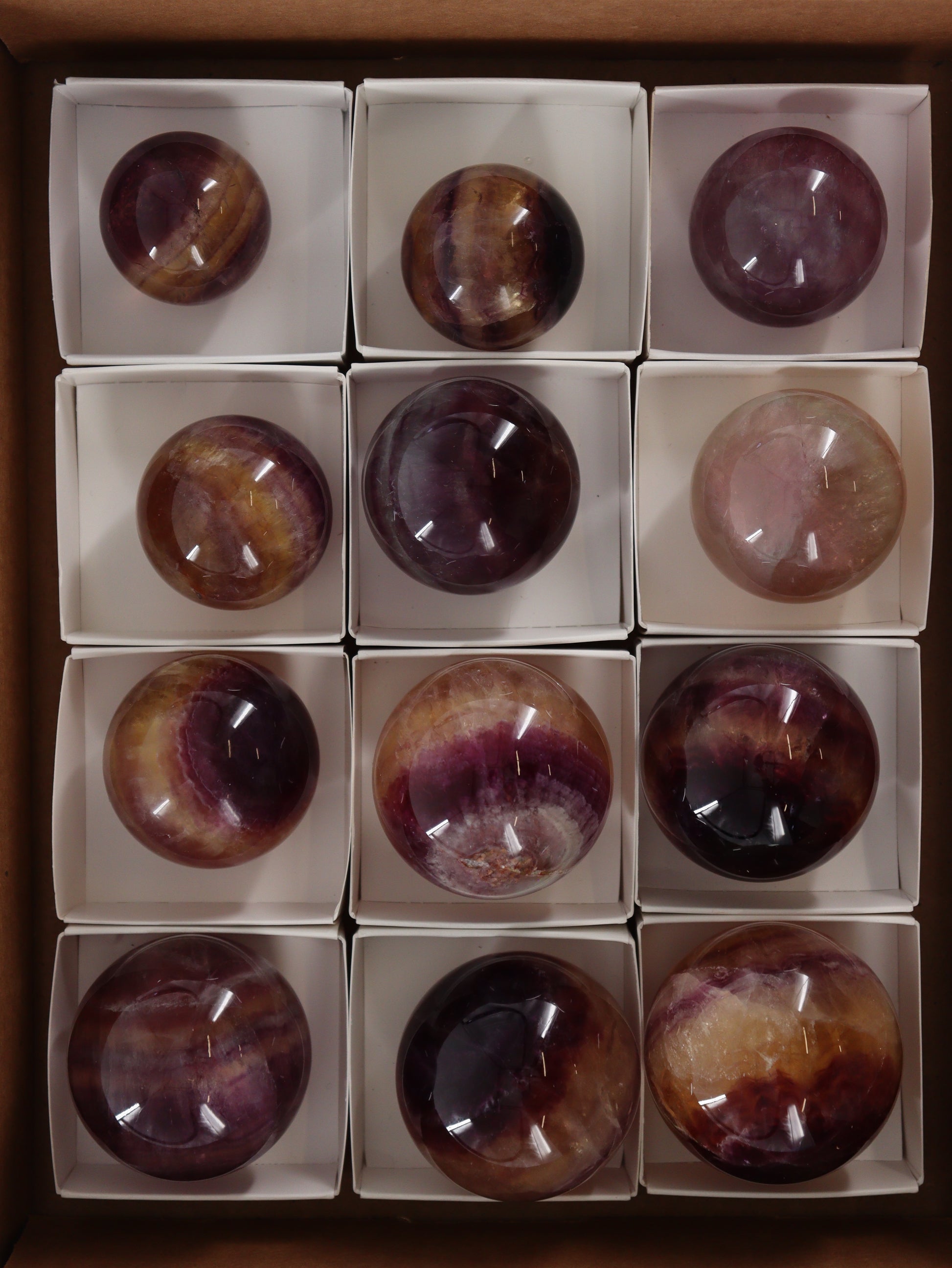 Fluorite Spheres Set of 12 - Expert Wholesale and Supplier of Wholesale Crystals & Bulk Gemstones, []