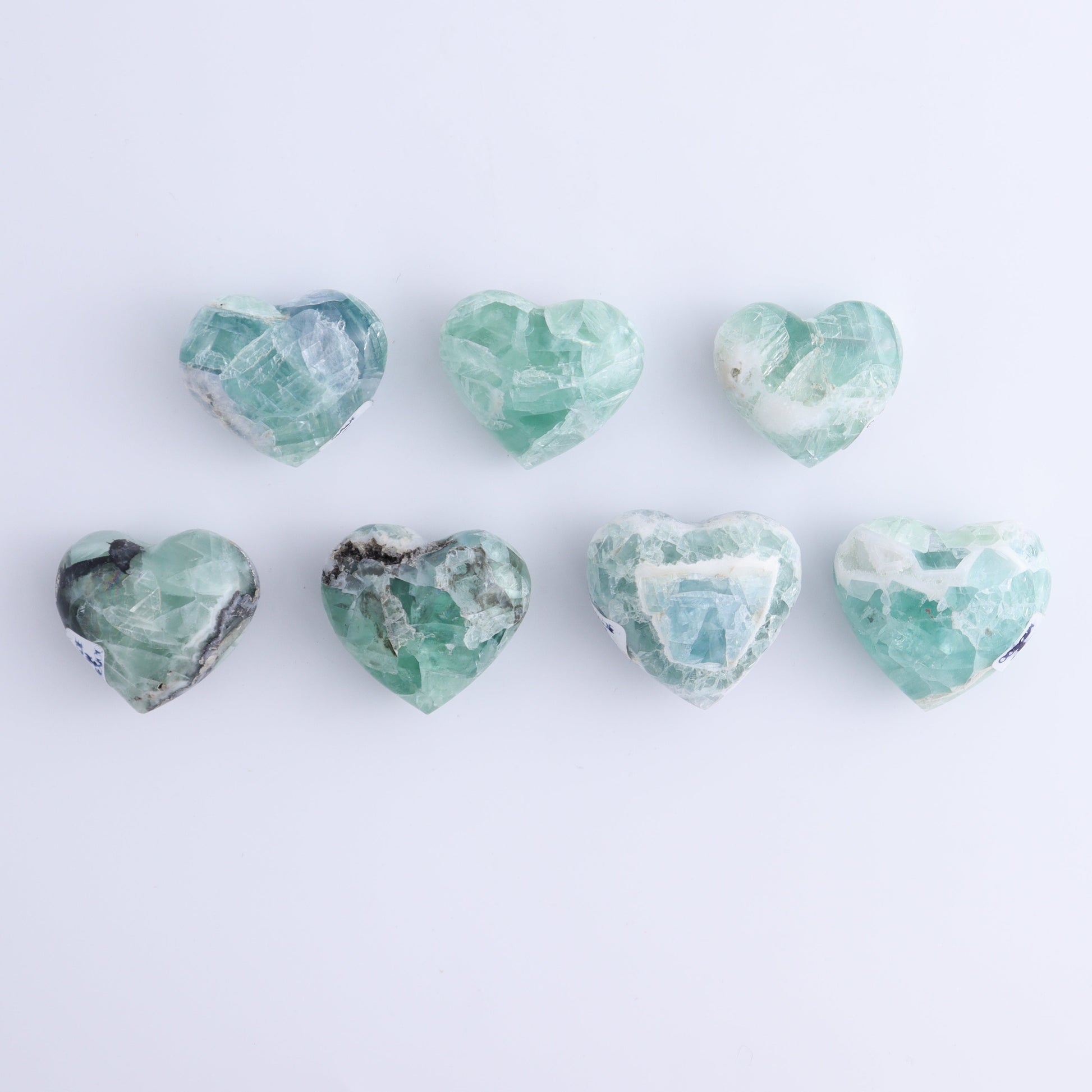 Fluorite Hearts Set of 7 - Expert Wholesale and Supplier of Wholesale Crystals & Bulk Gemstones, ["Fluorite","Hearts","Mexico"]