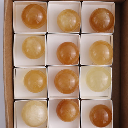Honey Calcite Spheres Set of 12 - Expert Wholesale and Supplier of Wholesale Crystals & Bulk Gemstones, ["Calcite","Honey Calcite","Mexico","Spheres"]