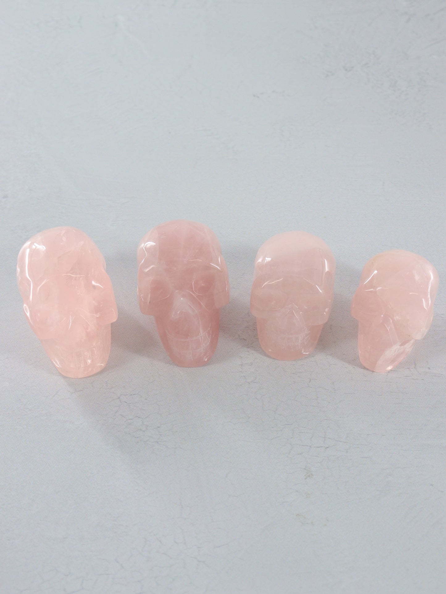 Rose Quartz Skulls Set of 4 - Expert Vendor of Wholesale Crystals