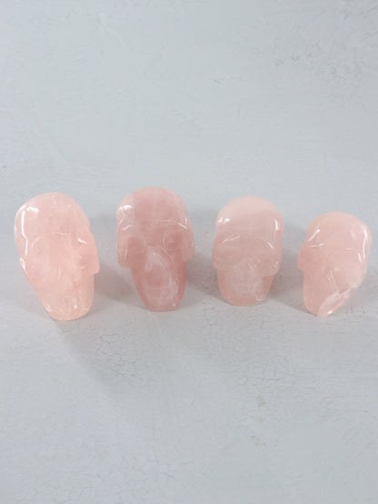 Rose Quartz Skulls Set of 4 - Expert Vendor of Wholesale Crystals