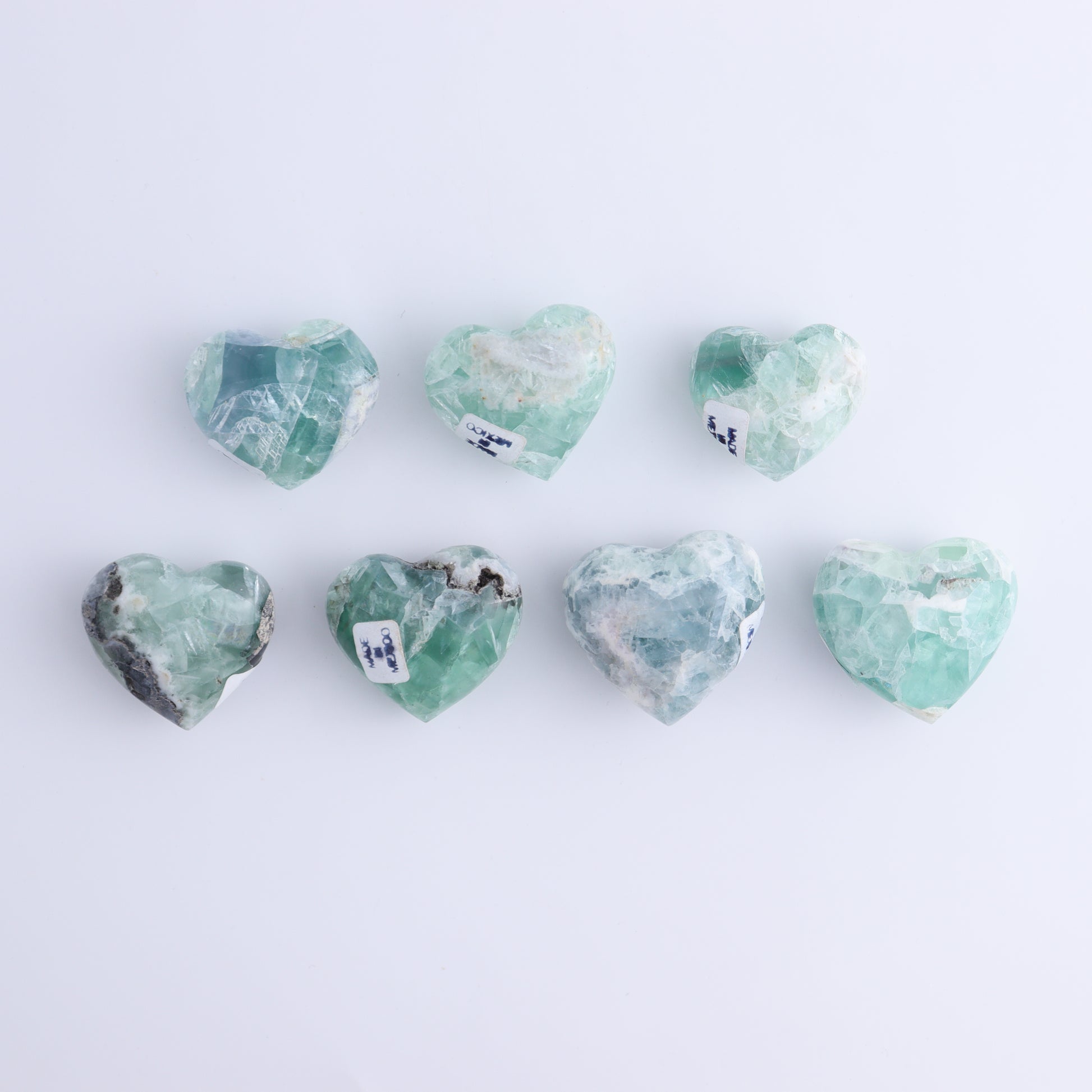 Fluorite Hearts Set of 7 - Expert Wholesale and Supplier of Wholesale Crystals & Bulk Gemstones, ["Fluorite","Hearts","Mexico"]