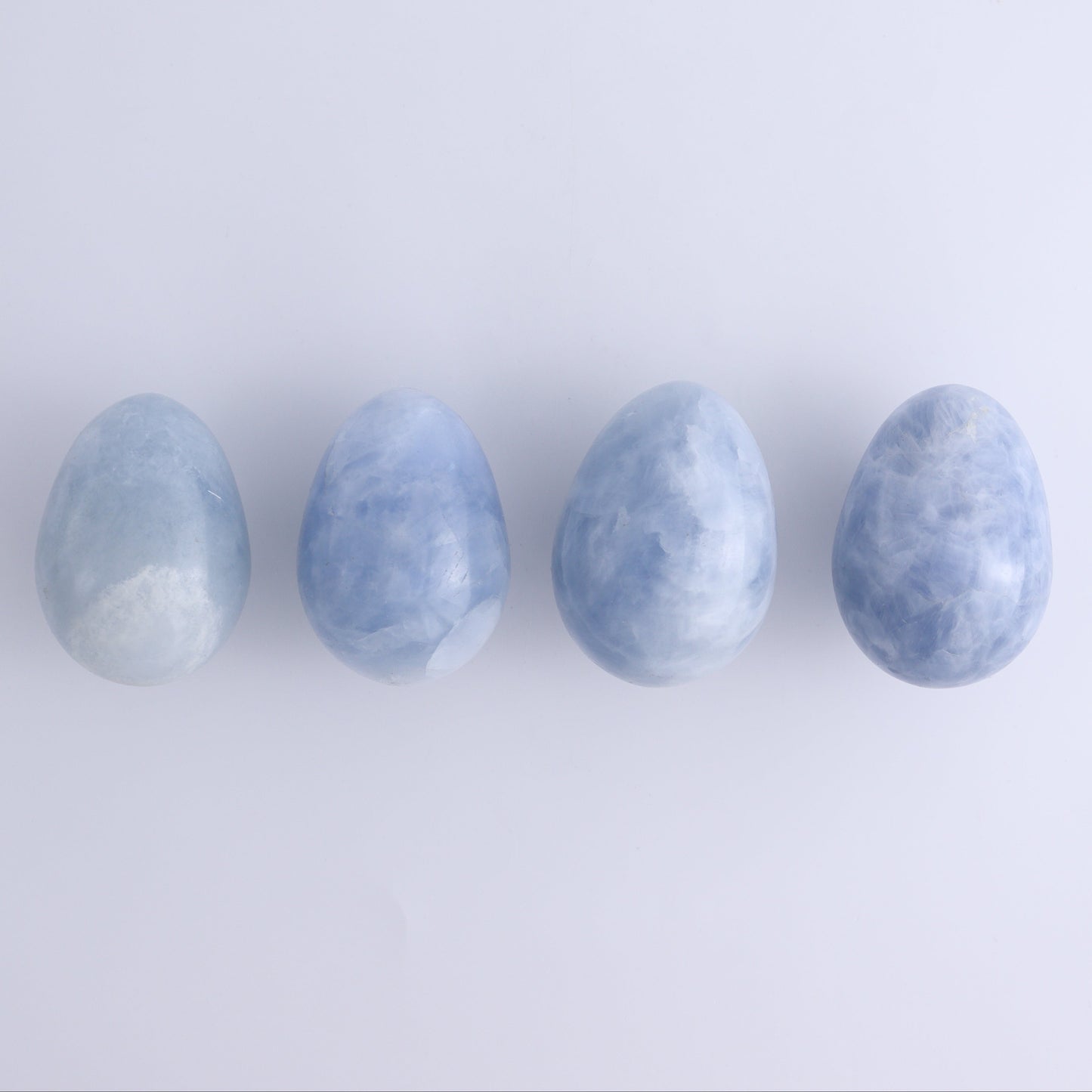Blue Calcite Eggs Set of 35 - Expert Wholesale and Supplier of Wholesale Crystals & Bulk Gemstones, ["Blue Calcite","Calcite","close_30","Eggs"]