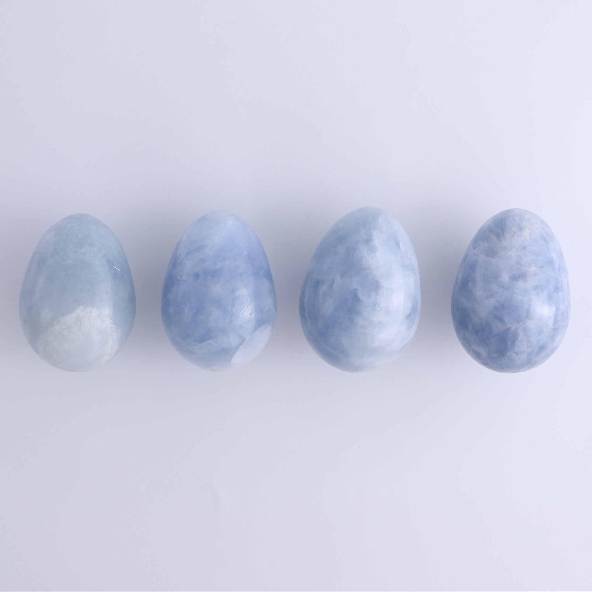 Blue Calcite Eggs Set of 35 - Expert Wholesale and Supplier of Wholesale Crystals & Bulk Gemstones, ["Blue Calcite","Calcite","close_30","Eggs"]