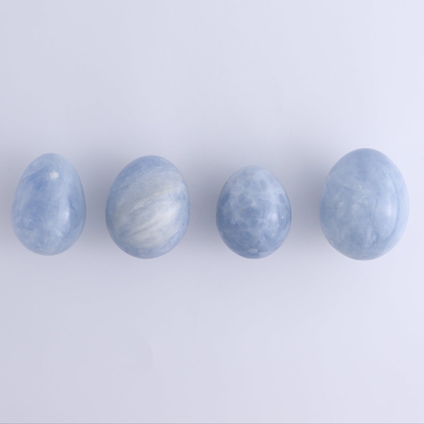 Blue Calcite Eggs Set of 35 - Expert Wholesale and Supplier of Wholesale Crystals & Bulk Gemstones, ["Blue Calcite","Calcite","close_30","Eggs"]