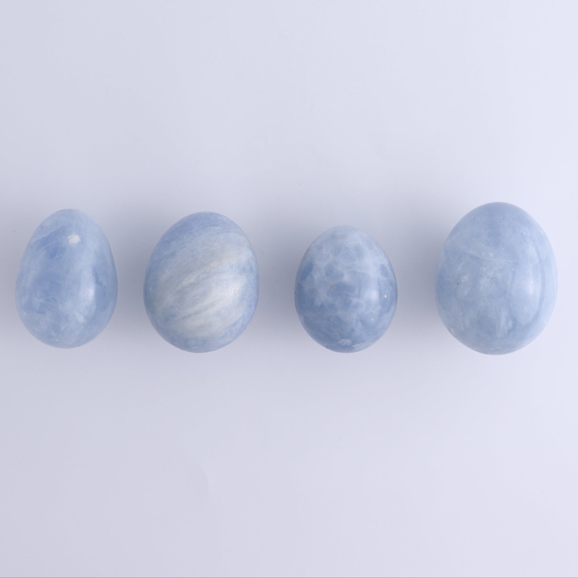 Blue Calcite Eggs Set of 35 - Expert Wholesale and Supplier of Wholesale Crystals & Bulk Gemstones, ["Blue Calcite","Calcite","close_30","Eggs"]