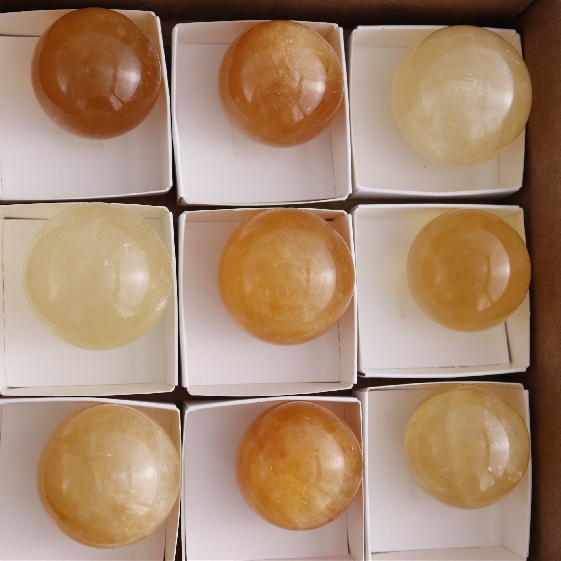 Honey Calcite Spheres Set of 12 - Expert Wholesale and Supplier of Wholesale Crystals & Bulk Gemstones, ["Calcite","Honey Calcite","Mexico","Spheres"]