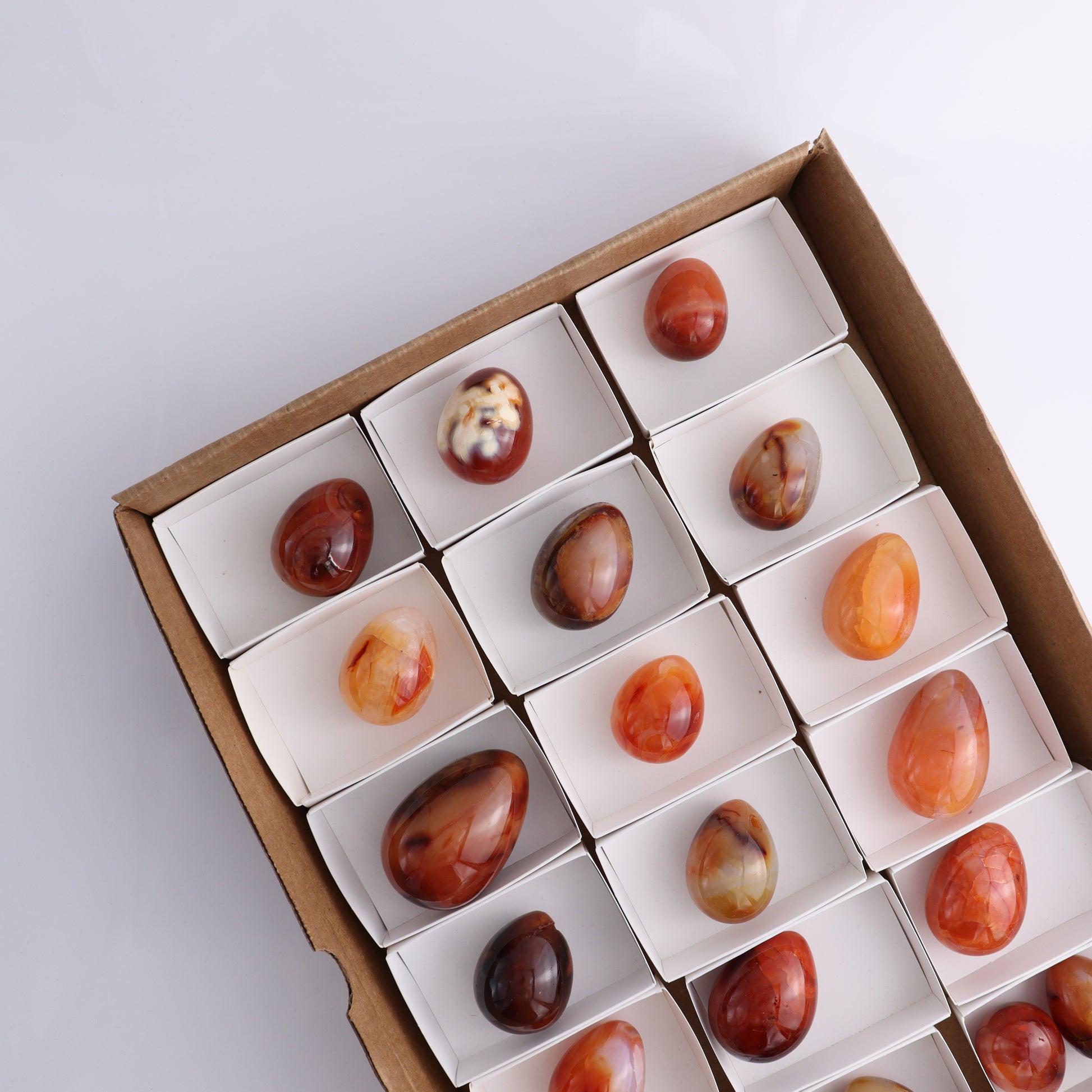 Carnelian Eggs Flat of 20 - Expert Wholesale and Supplier of Wholesale Crystals & Bulk Gemstones, ["carnelian","Eggs","Madagascar"]