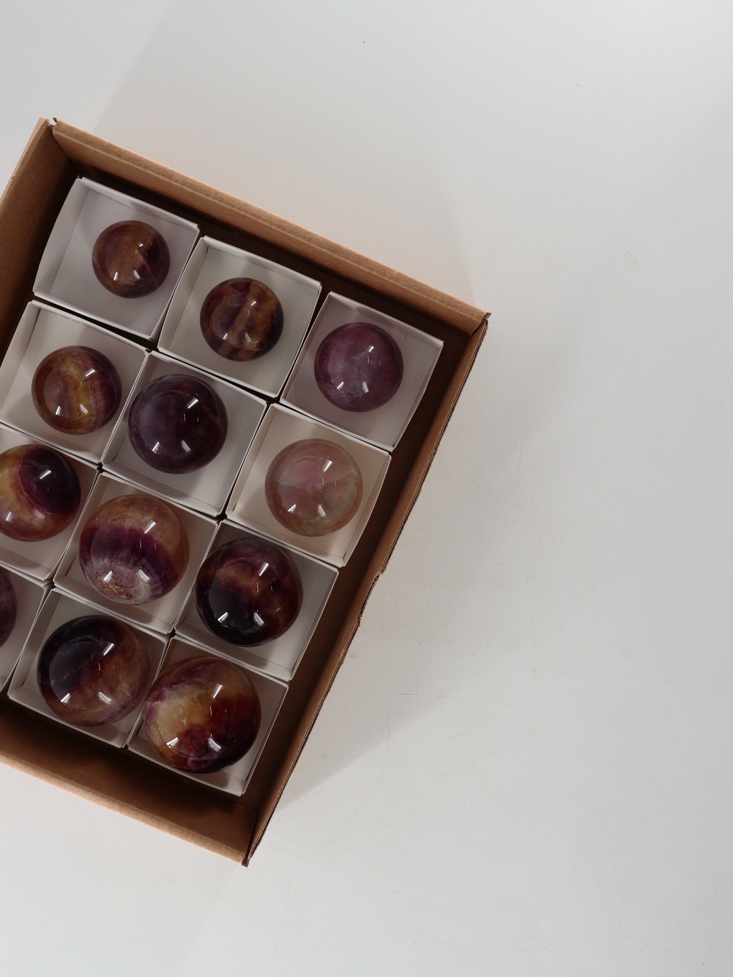 Fluorite Spheres Set of 12 - Expert Wholesale and Supplier of Wholesale Crystals & Bulk Gemstones, []