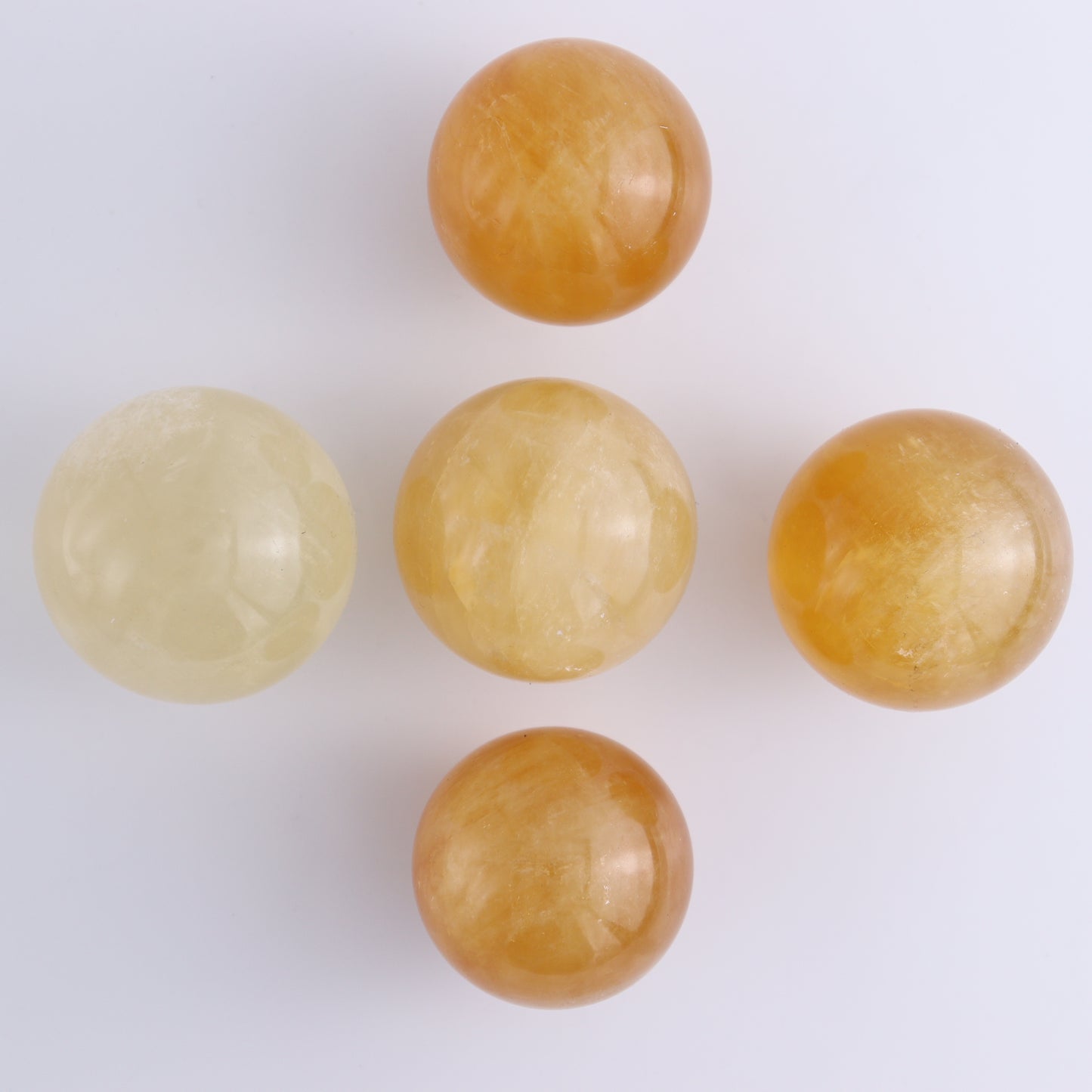 Honey Calcite Spheres Set of 12 - Expert Wholesale and Supplier of Wholesale Crystals & Bulk Gemstones, ["Calcite","Honey Calcite","Mexico","Spheres"]