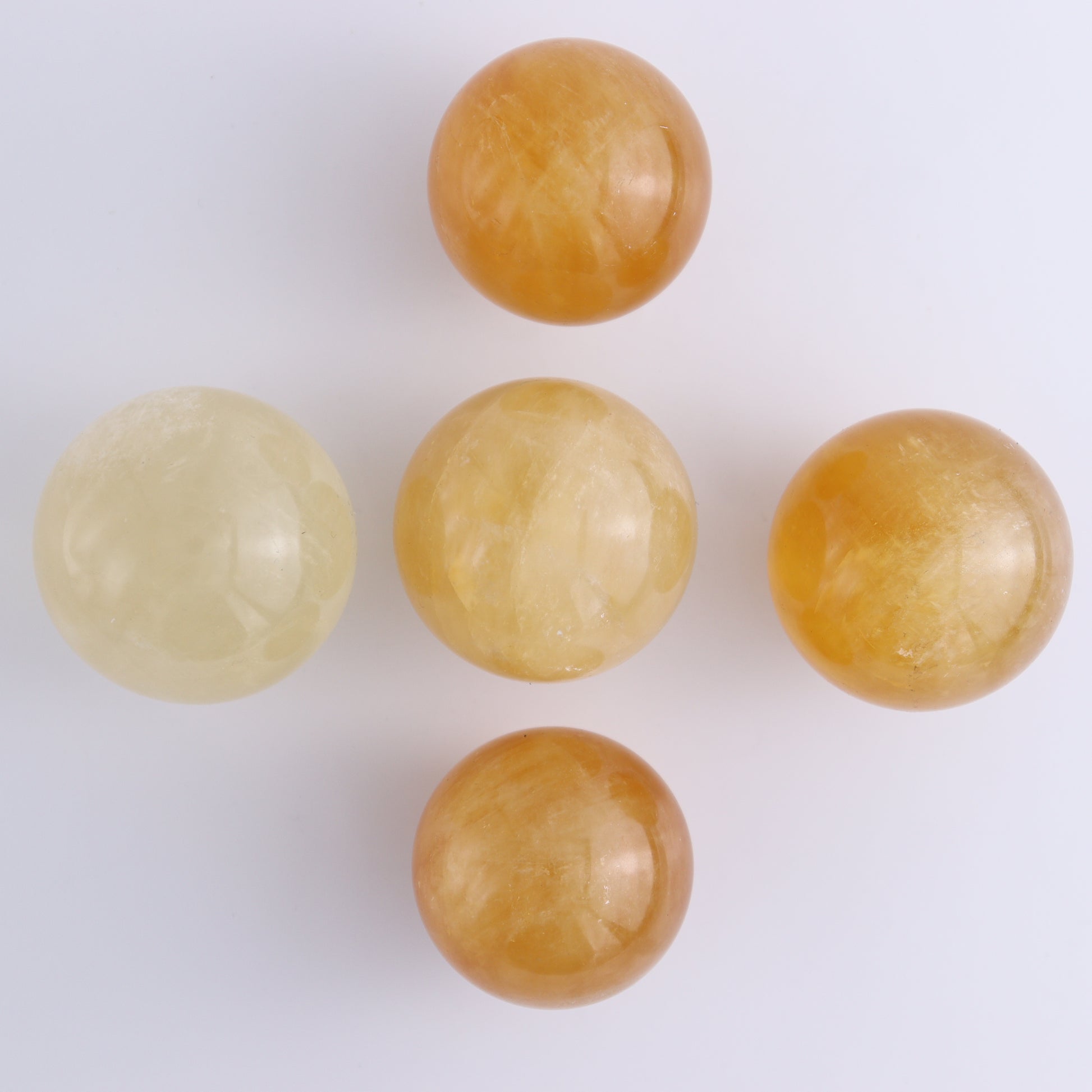 Honey Calcite Spheres Set of 12 - Expert Wholesale and Supplier of Wholesale Crystals & Bulk Gemstones, ["Calcite","Honey Calcite","Mexico","Spheres"]