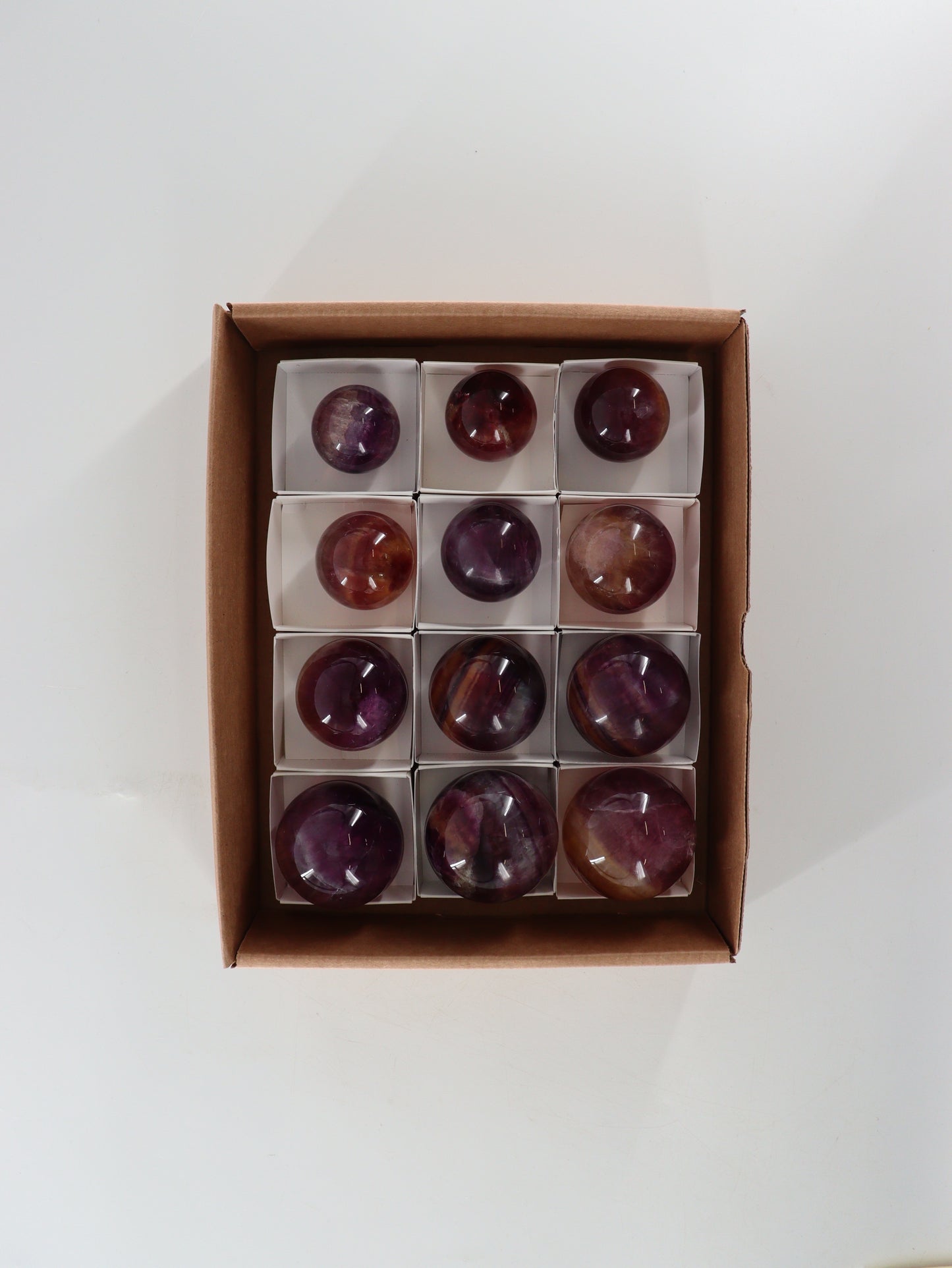 Fluorite Spheres Set of 12 - Expert Wholesale and Supplier of Wholesale Crystals & Bulk Gemstones, []