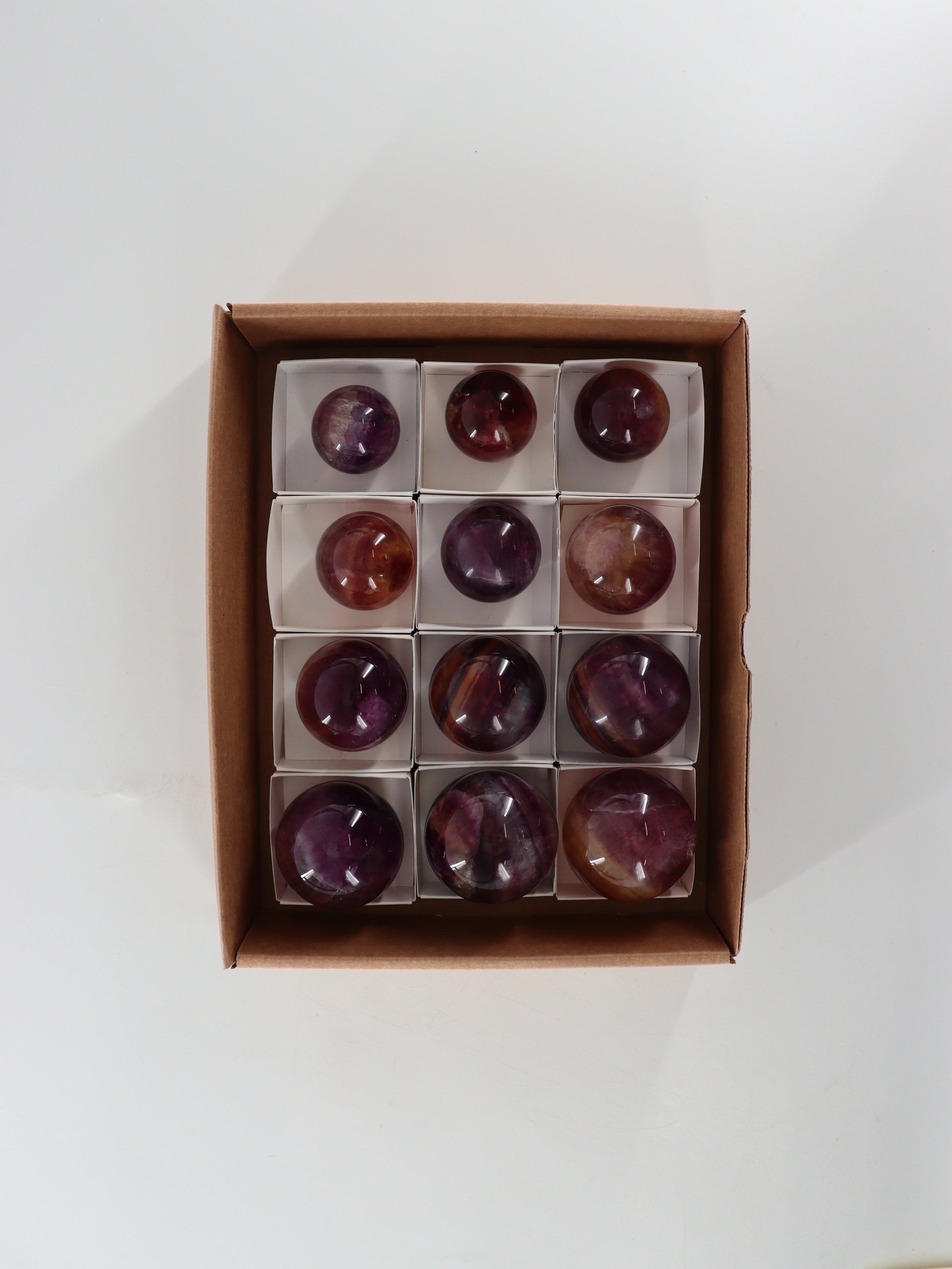 Fluorite Spheres Set of 12 - Expert Wholesale and Supplier of Wholesale Crystals & Bulk Gemstones, []