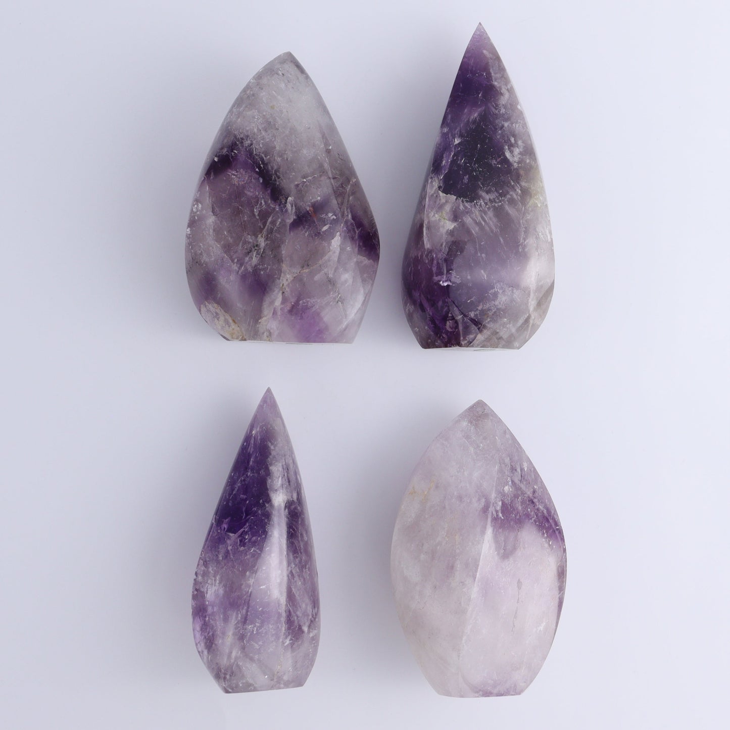 Imperfect Amethyst Flames Set of 4 - Expert Wholesale and Supplier of Wholesale Crystals & Bulk Gemstones, ["Amethyst","Brazil","close_30","flames"]