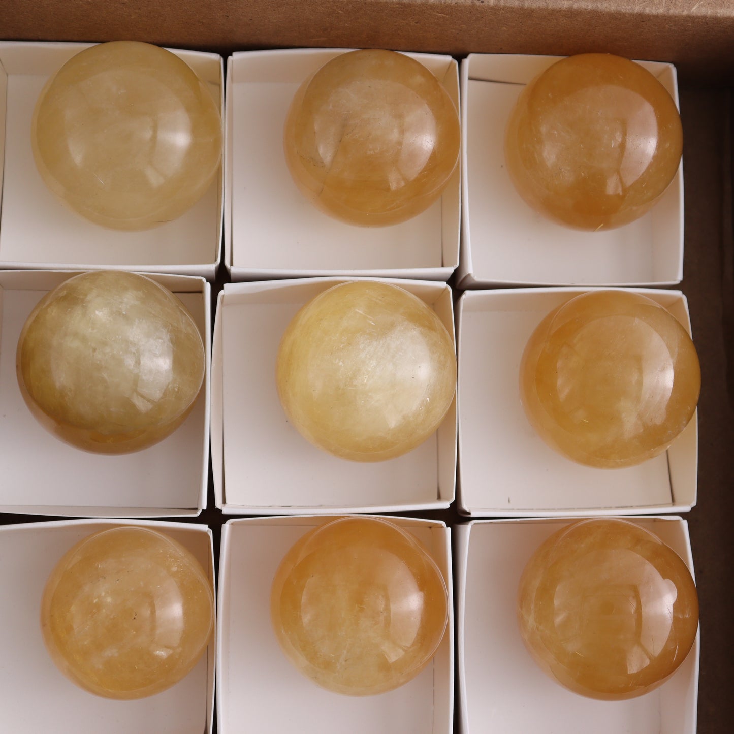 Honey Calcite Spheres Set of 12 - Expert Wholesale and Supplier of Wholesale Crystals & Bulk Gemstones, ["Calcite","Honey Calcite","Mexico","Spheres"]
