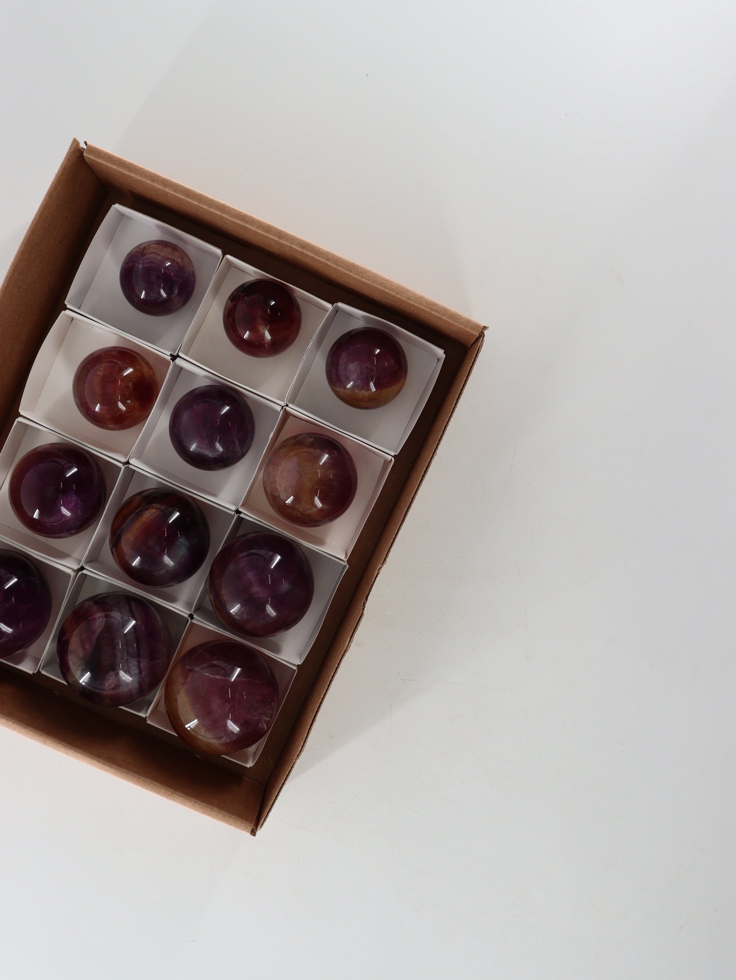 Fluorite Spheres Set of 12 - Expert Wholesale and Supplier of Wholesale Crystals & Bulk Gemstones, []