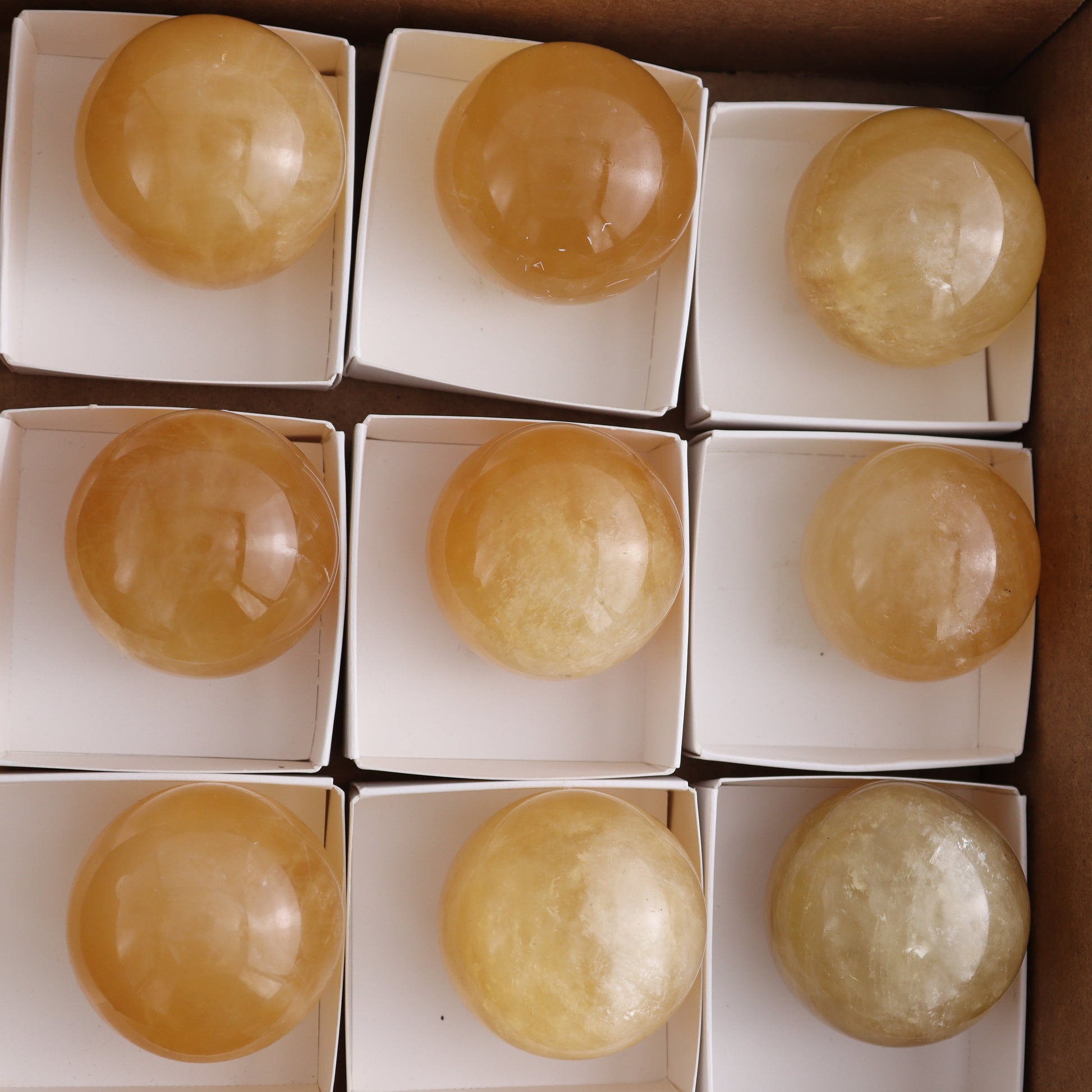 Honey Calcite Spheres Set of 12 - Expert Wholesale and Supplier of Wholesale Crystals & Bulk Gemstones, ["Calcite","Honey Calcite","Mexico","Spheres"]