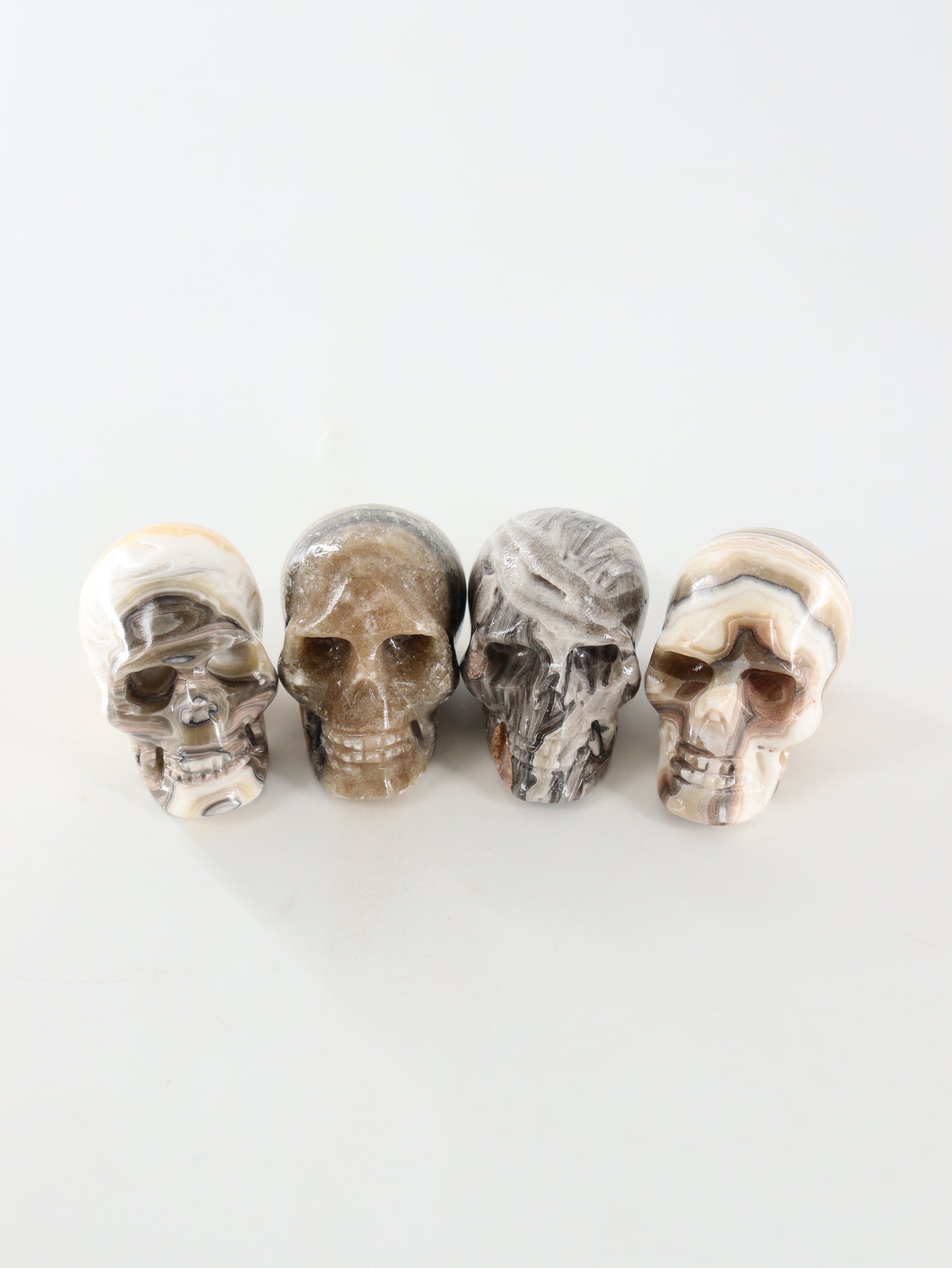 Small Onyx Skulls Set of 4 - Expert Wholesale and Supplier of Wholesale Crystals & Bulk Gemstones, []