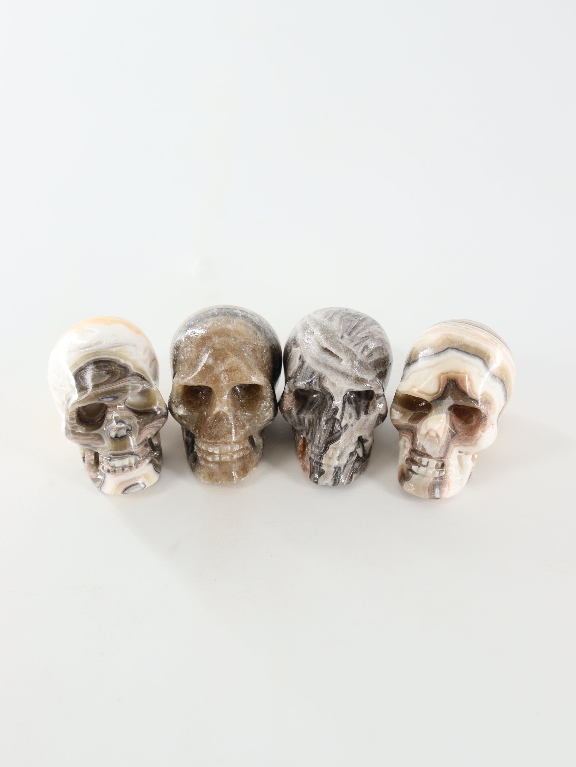 Small Onyx Skulls Set of 4 - Expert Wholesale and Supplier of Wholesale Crystals & Bulk Gemstones, []