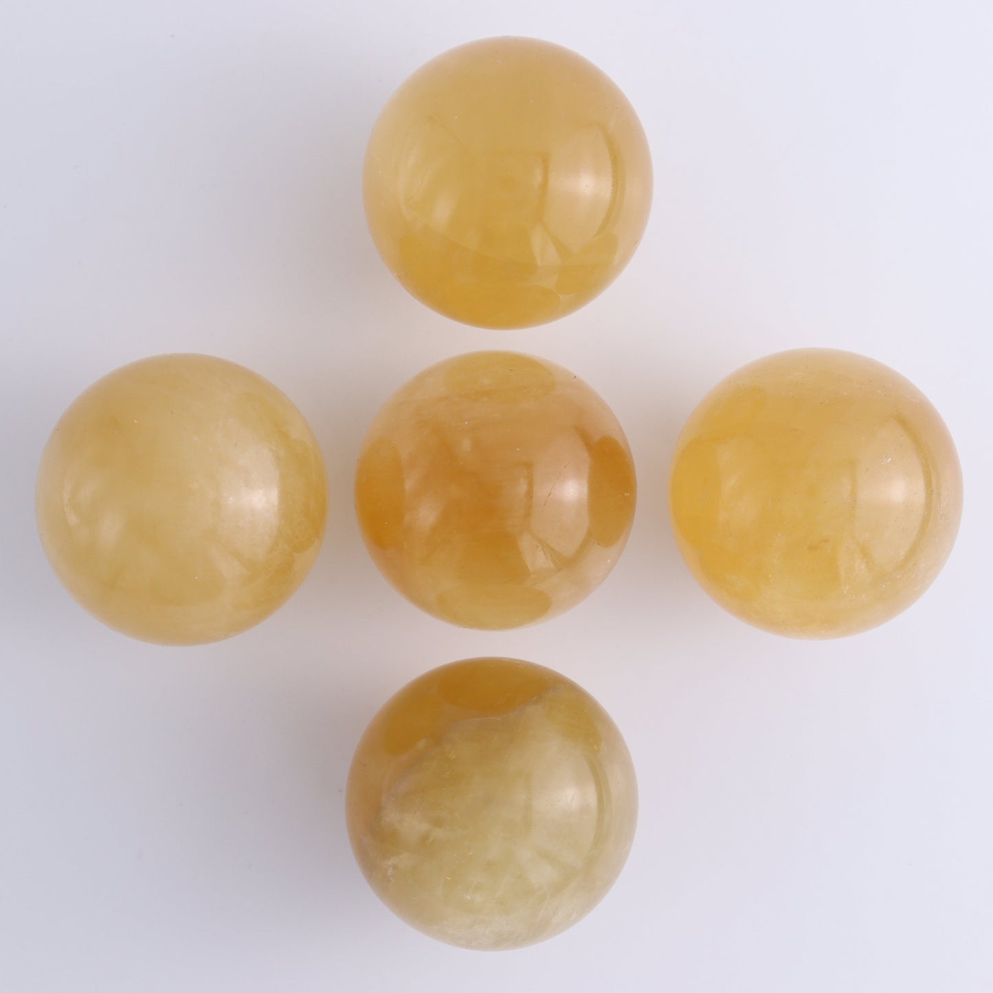 Honey Calcite Spheres Set of 12 - Expert Wholesale and Supplier of Wholesale Crystals & Bulk Gemstones, ["Calcite","Honey Calcite","Mexico","Spheres"]
