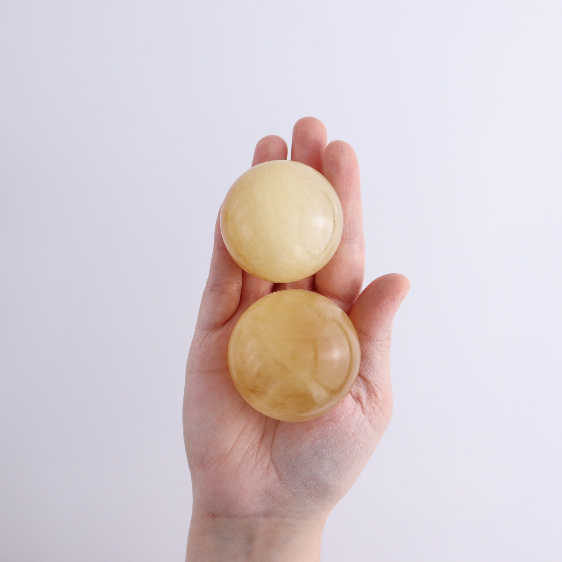 Honey Calcite Spheres Set of 12 - Expert Wholesale and Supplier of Wholesale Crystals & Bulk Gemstones, ["Calcite","Honey Calcite","Mexico","Spheres"]