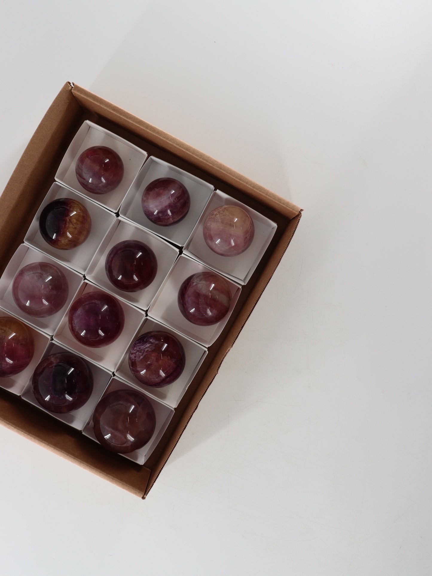 Fluorite Spheres Set of 12 - Expert Wholesale and Supplier of Wholesale Crystals & Bulk Gemstones, []