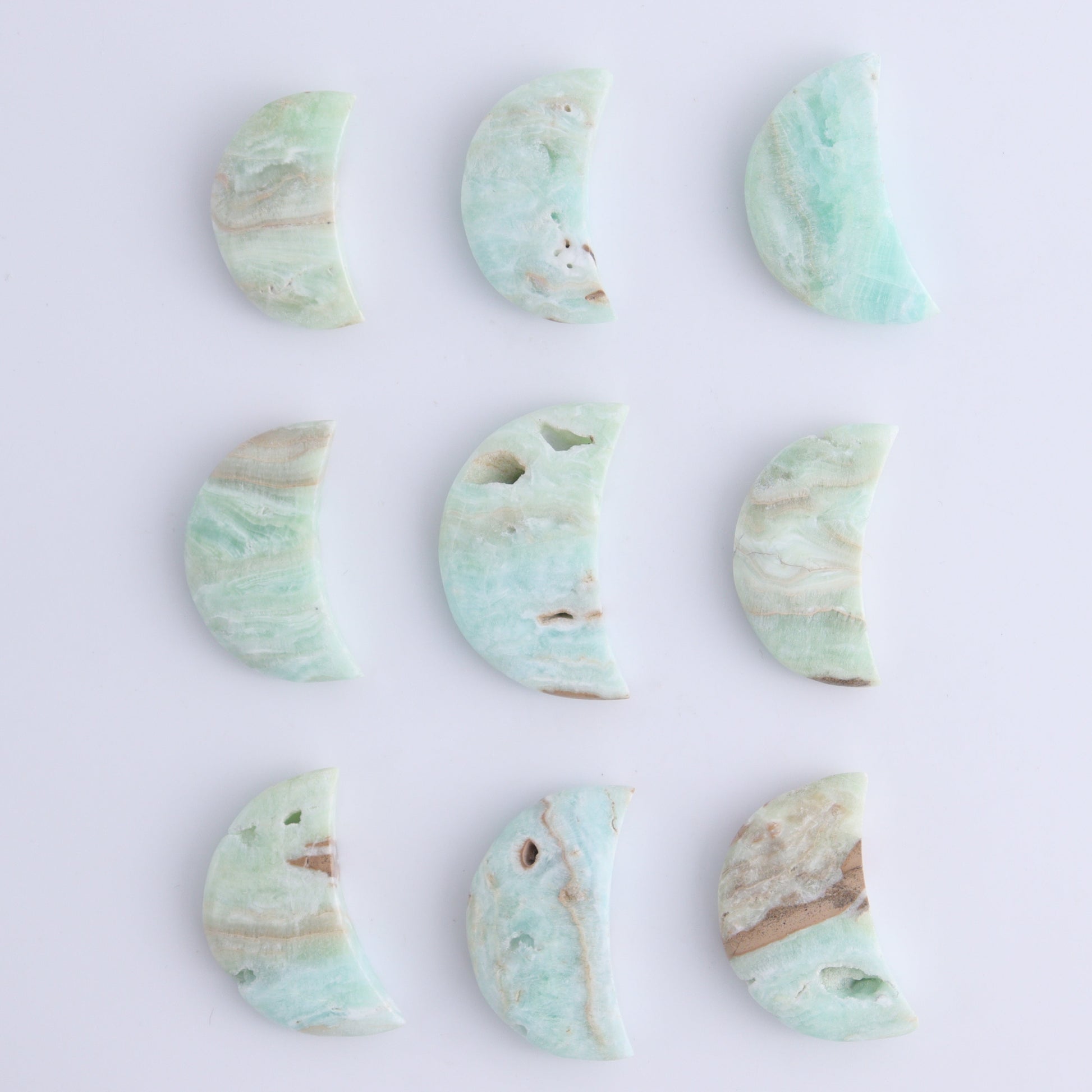One Caribbean Calcite Little Moon - Expert Wholesale and Supplier of Wholesale Crystals & Bulk Gemstones, ["Calcite","Caribbean Calcite","moons","Pakistan"]