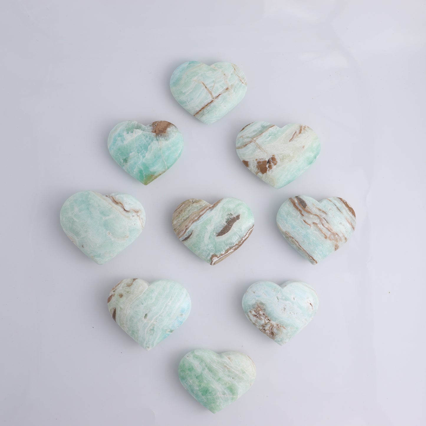 Caribbean Calcite Hearts Flat of 9 - Expert Wholesale and Supplier of Wholesale Crystals & Bulk Gemstones, ["Caribbean Calcite","Hearts","Madagascar"]