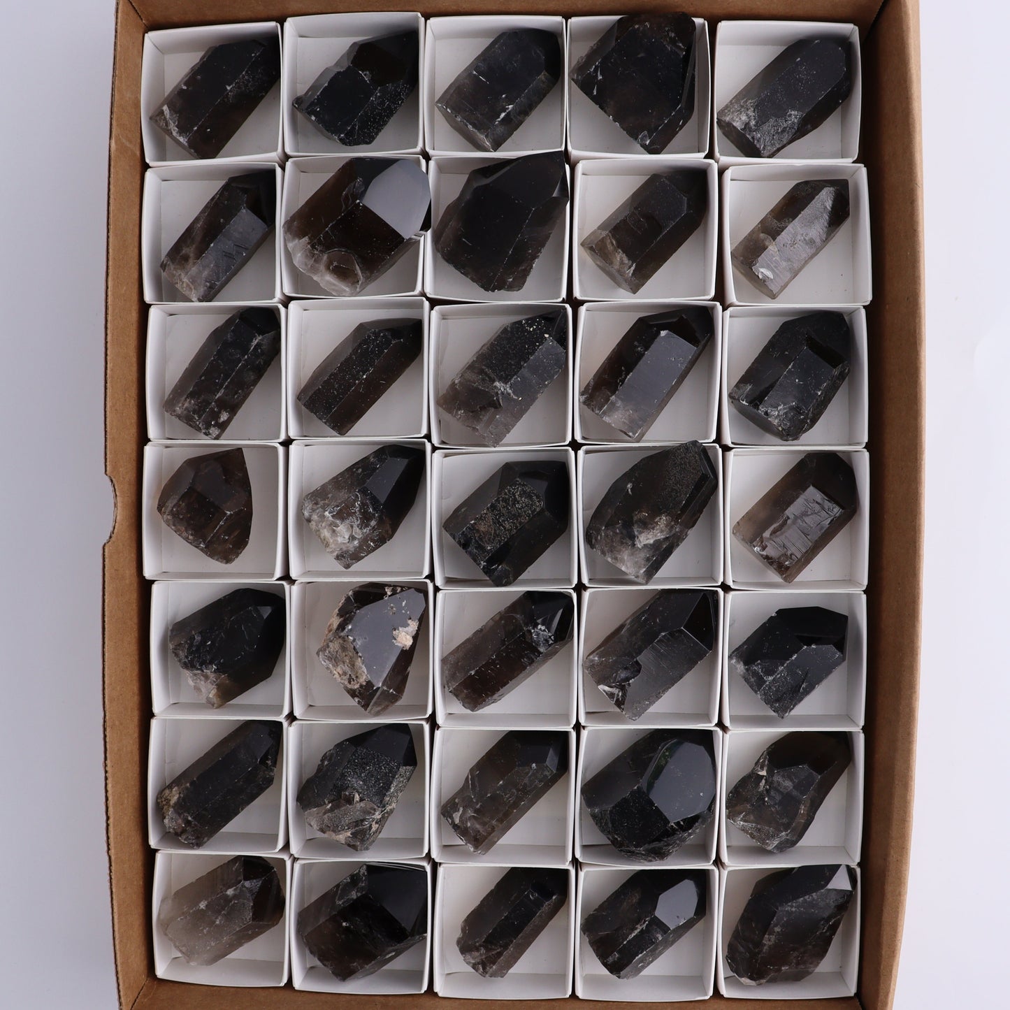 Smoky Quartz Polished Tops Set of 35 - Expert Wholesale and Supplier of Wholesale Crystals & Bulk Gemstones, ["Brazil","close_70","Points","Quartz","Smoky Quartz"]