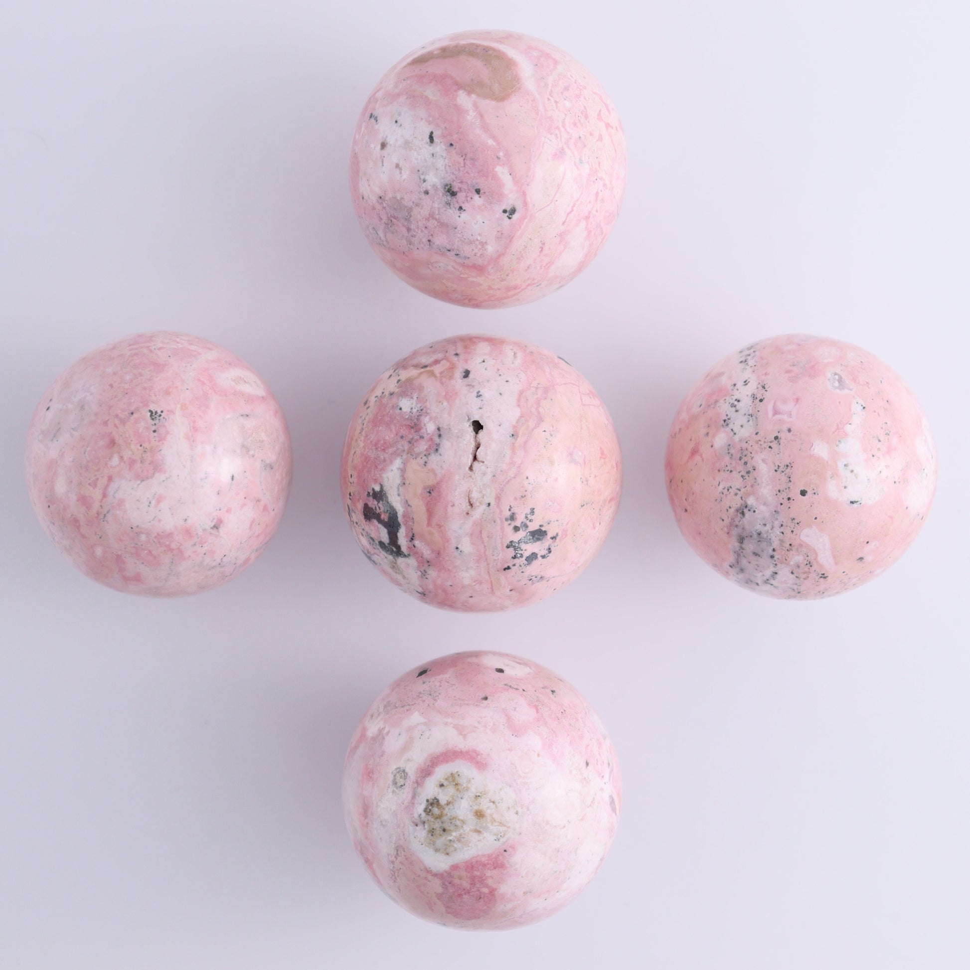 Rhodonite Spheres Set of 9 - Expert Wholesale and Supplier of Wholesale Crystals & Bulk Gemstones, ["Peru","Rhodonite","Spheres"]