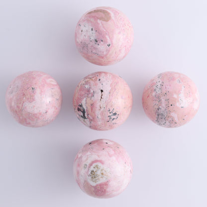 Rhodonite Spheres Set of 9 - Expert Wholesale and Supplier of Wholesale Crystals & Bulk Gemstones, ["Peru","Rhodonite","Spheres"]