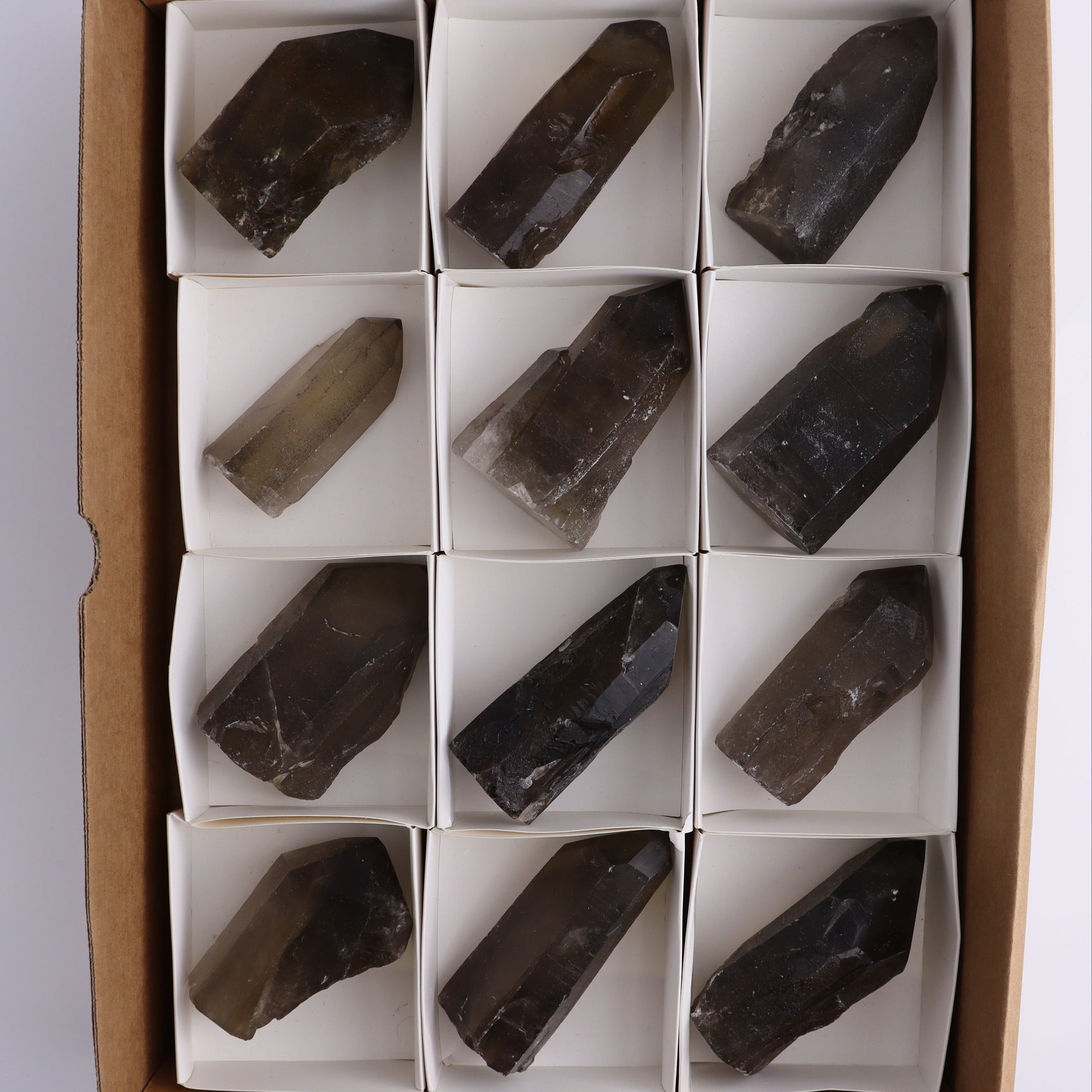 Smoky Quartz Polished Tops Set of 12 - Expert Wholesale and Supplier of Wholesale Crystals & Bulk Gemstones, ["Brazil","close_70","Points","Quartz","Smoky Quartz"]