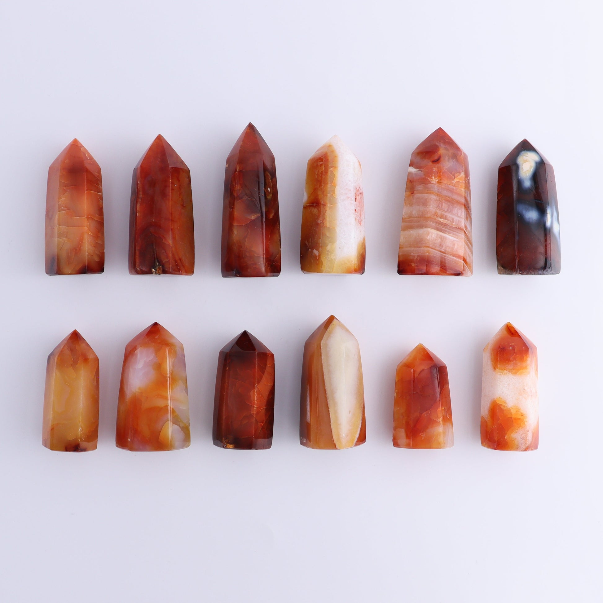 Carnelian Towers Set of 12 - Expert Wholesale and Supplier of Wholesale Crystals & Bulk Gemstones, ["carnelian","Madagascar","Towers"]