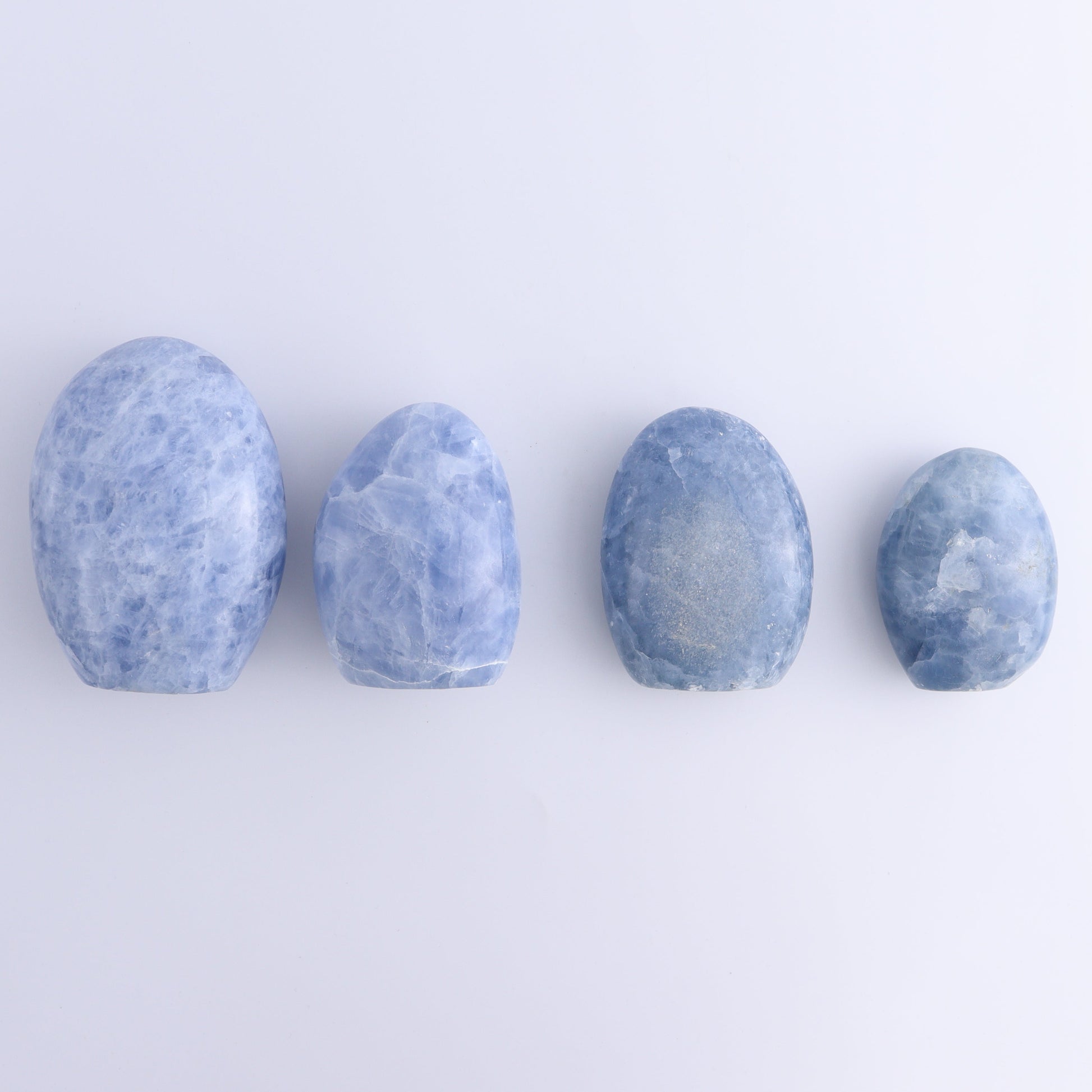 Blue Calcite Freeforms Set of 4 - Expert Wholesale and Supplier of Wholesale Crystals & Bulk Gemstones, ["Blue Calcite","Calcite","Freeform","Freeforms"]