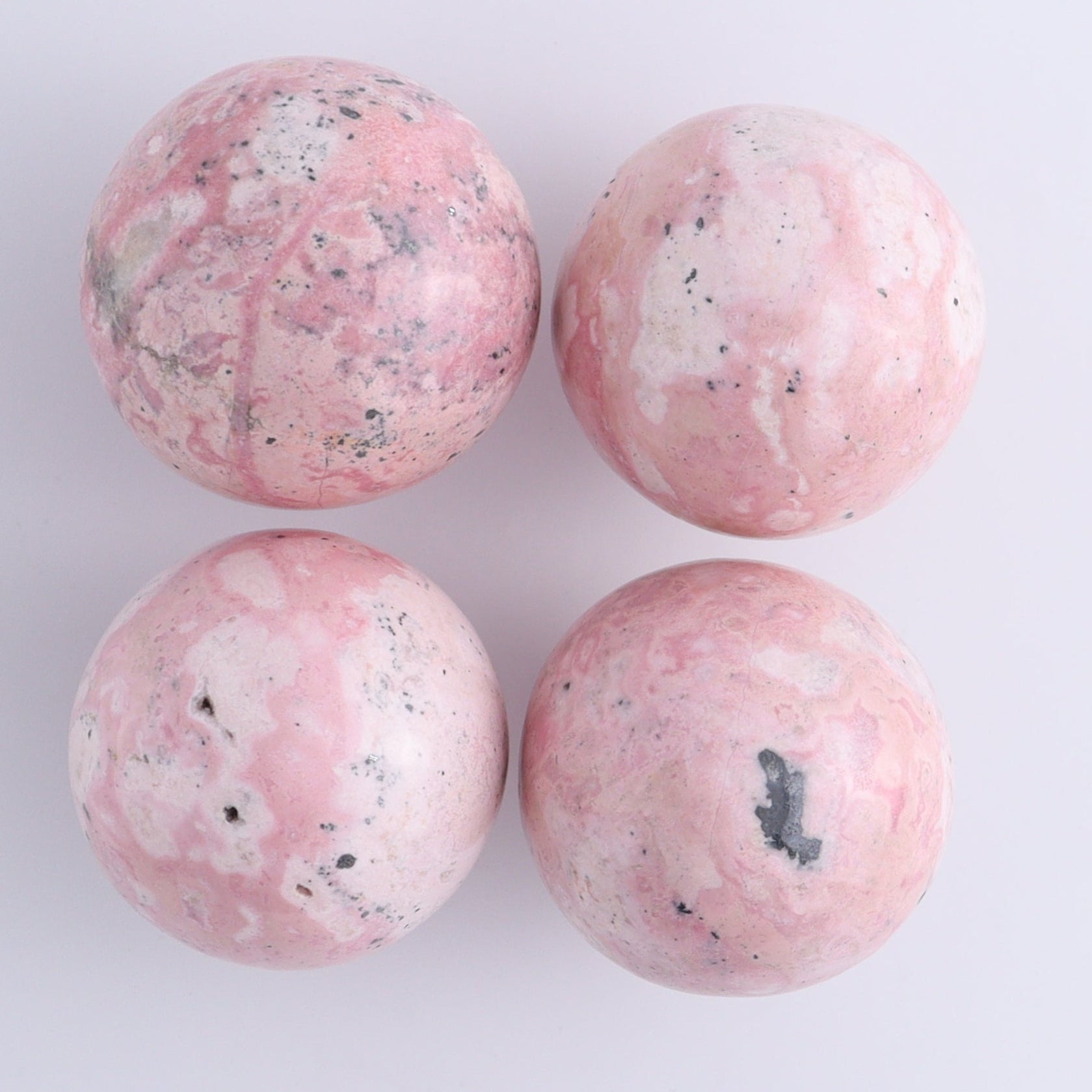 Rhodonite Spheres Set of 9 - Expert Wholesale and Supplier of Wholesale Crystals & Bulk Gemstones, ["Peru","Rhodonite","Spheres"]