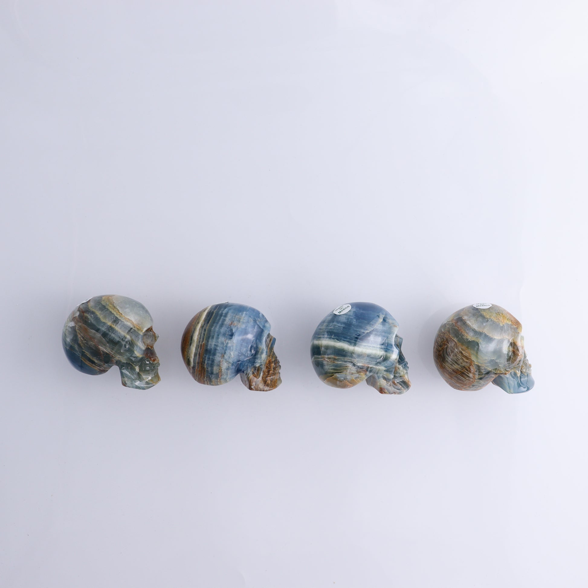 Onyx Skulls Set of 4 - Expert Wholesale and Supplier of Wholesale Crystals & Bulk Gemstones, ["Mexico","onyx","Skulls"]