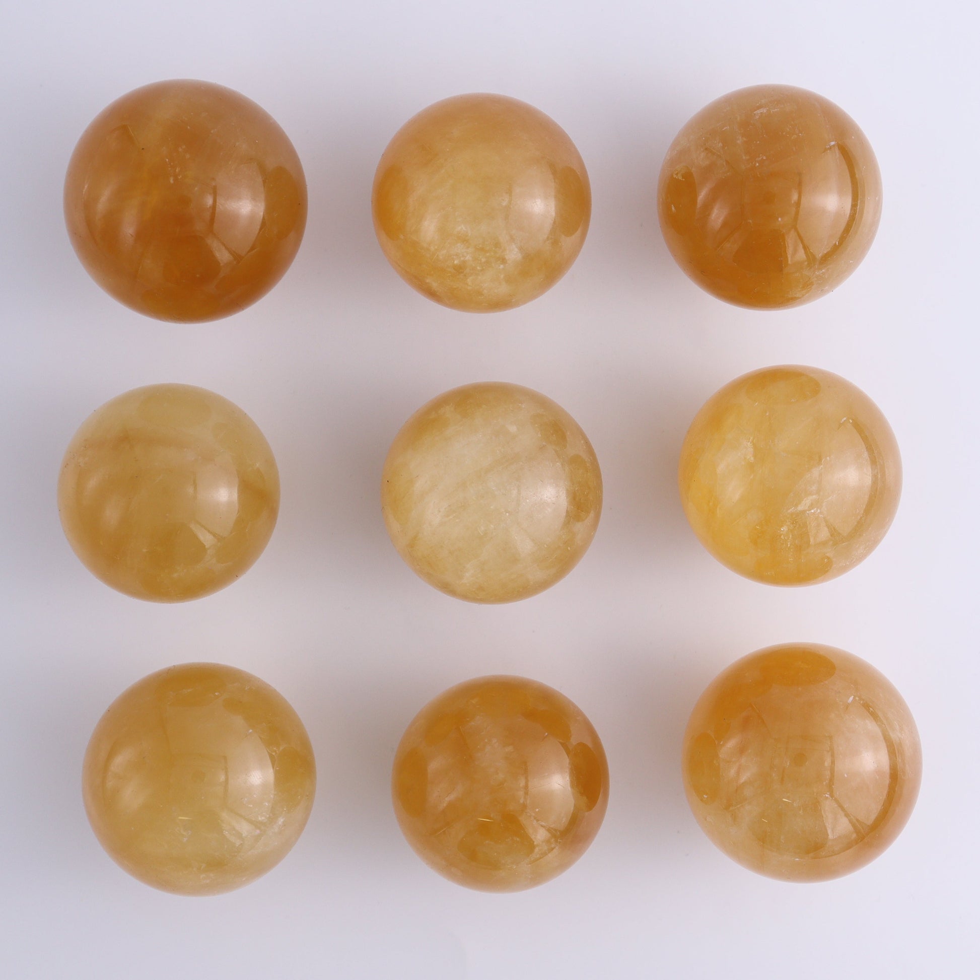 Calcite Spheres Set of 9 - Expert Wholesale and Supplier of Wholesale Crystals & Bulk Gemstones, ["Calcite","Mexico","Spheres"]