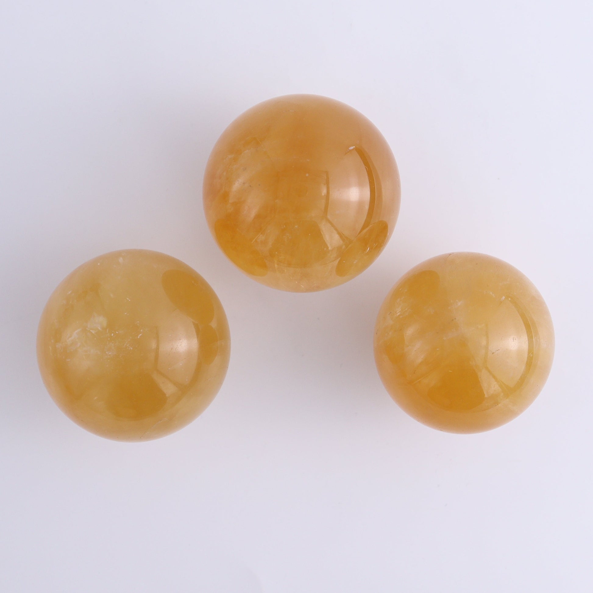 Calcite Spheres Set of 9 - Expert Wholesale and Supplier of Wholesale Crystals & Bulk Gemstones, ["Calcite","Mexico","Spheres"]