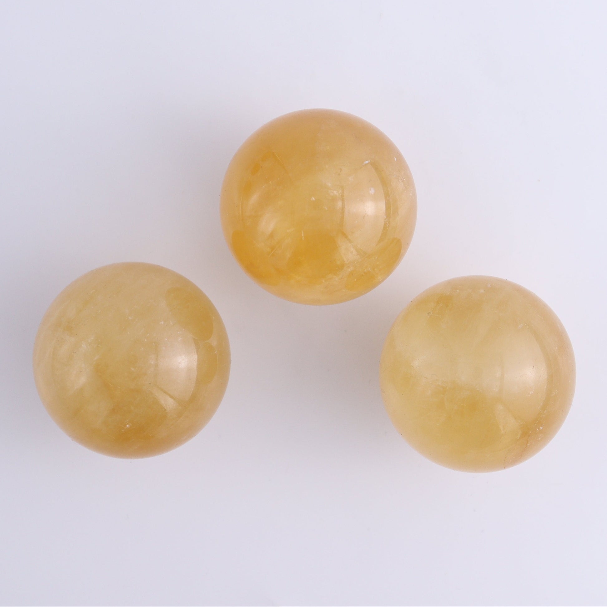 Calcite Spheres Set of 9 - Expert Wholesale and Supplier of Wholesale Crystals & Bulk Gemstones, ["Calcite","Mexico","Spheres"]