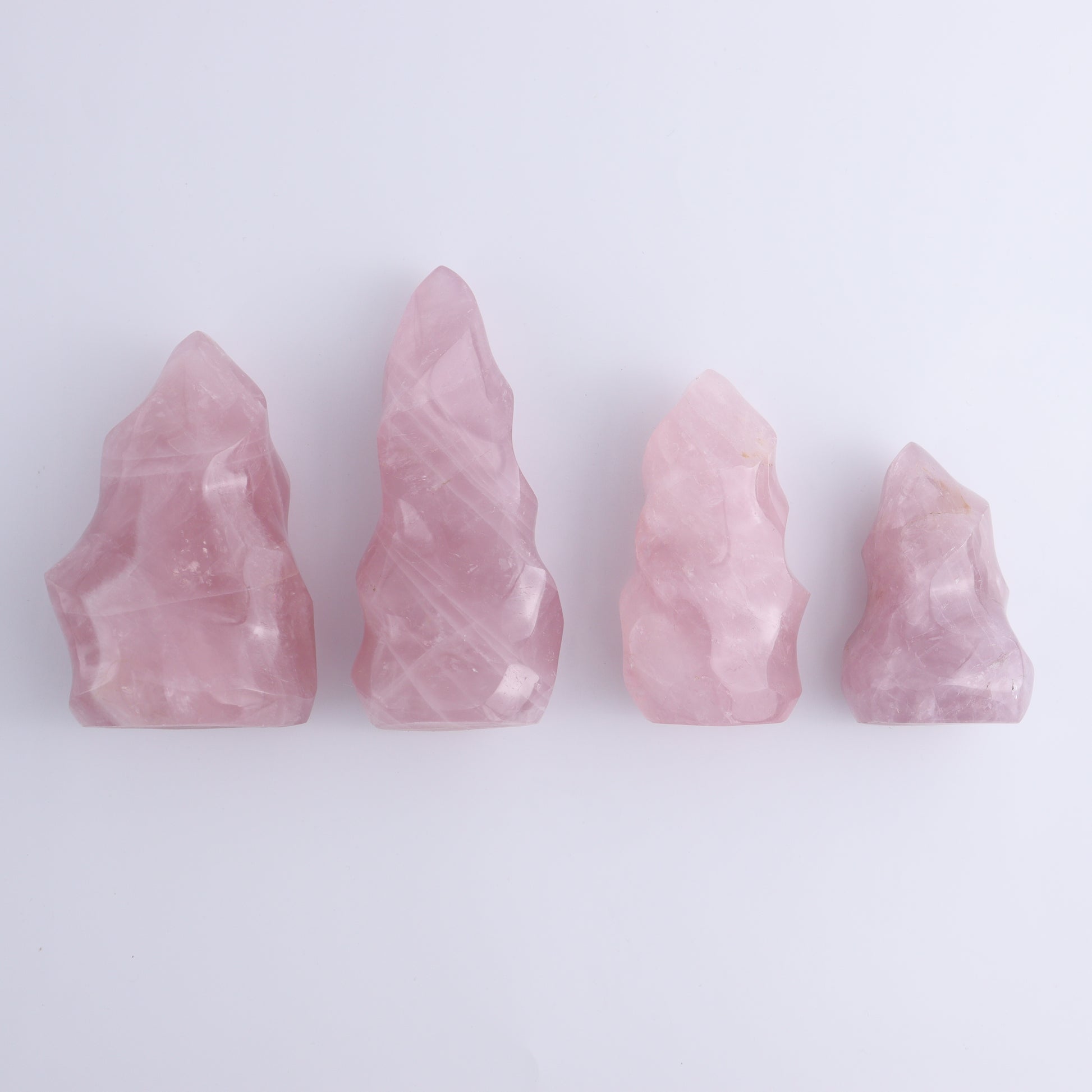 Rose Quartz Flames Set of 4 - Expert Wholesale and Supplier of Wholesale Crystals & Bulk Gemstones, ["flames","Madagascar","Quartz","Rose Quartz"]