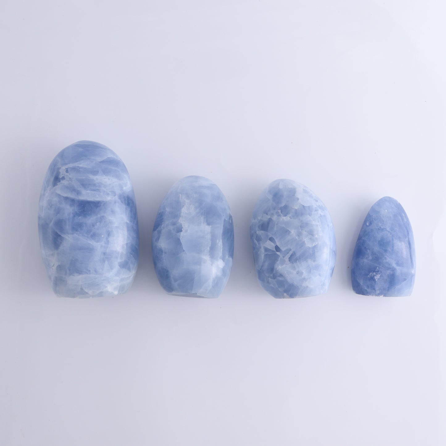 Blue Calcite Set of 4 - Expert Wholesale and Supplier of Wholesale Crystals & Bulk Gemstones, ["Blue Calcite","Calcite","Freeform","Madagascar"]