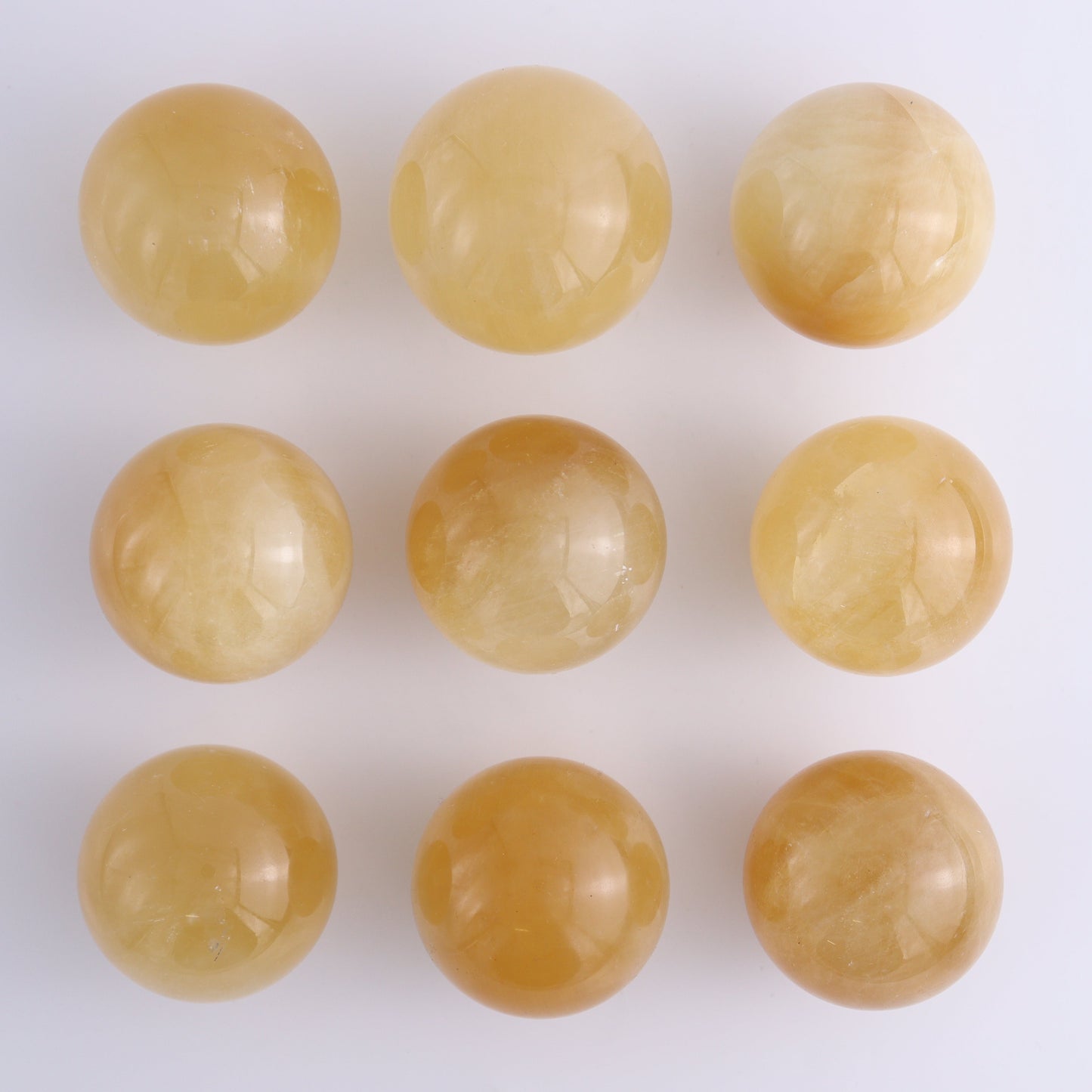 Calcite Spheres Set of 9 - Expert Wholesale and Supplier of Wholesale Crystals & Bulk Gemstones, ["Calcite","Mexico","Spheres"]