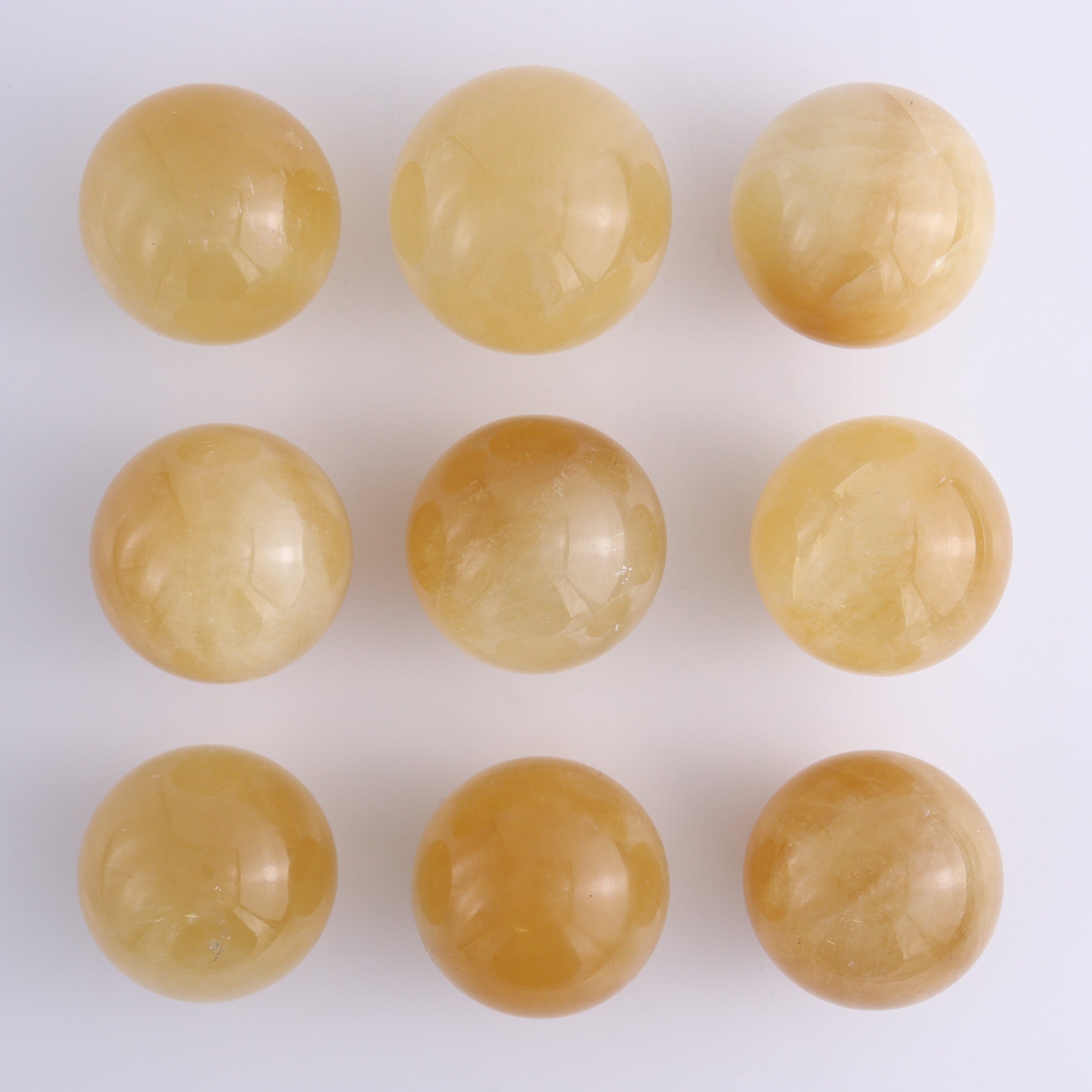 Calcite Spheres Set of 9 - Expert Wholesale and Supplier of Wholesale Crystals & Bulk Gemstones, ["Calcite","Mexico","Spheres"]