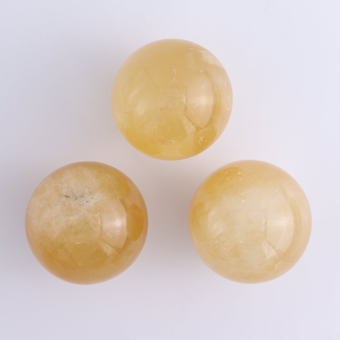 Calcite Spheres Set of 9 - Expert Wholesale and Supplier of Wholesale Crystals & Bulk Gemstones, ["Calcite","Mexico","Spheres"]