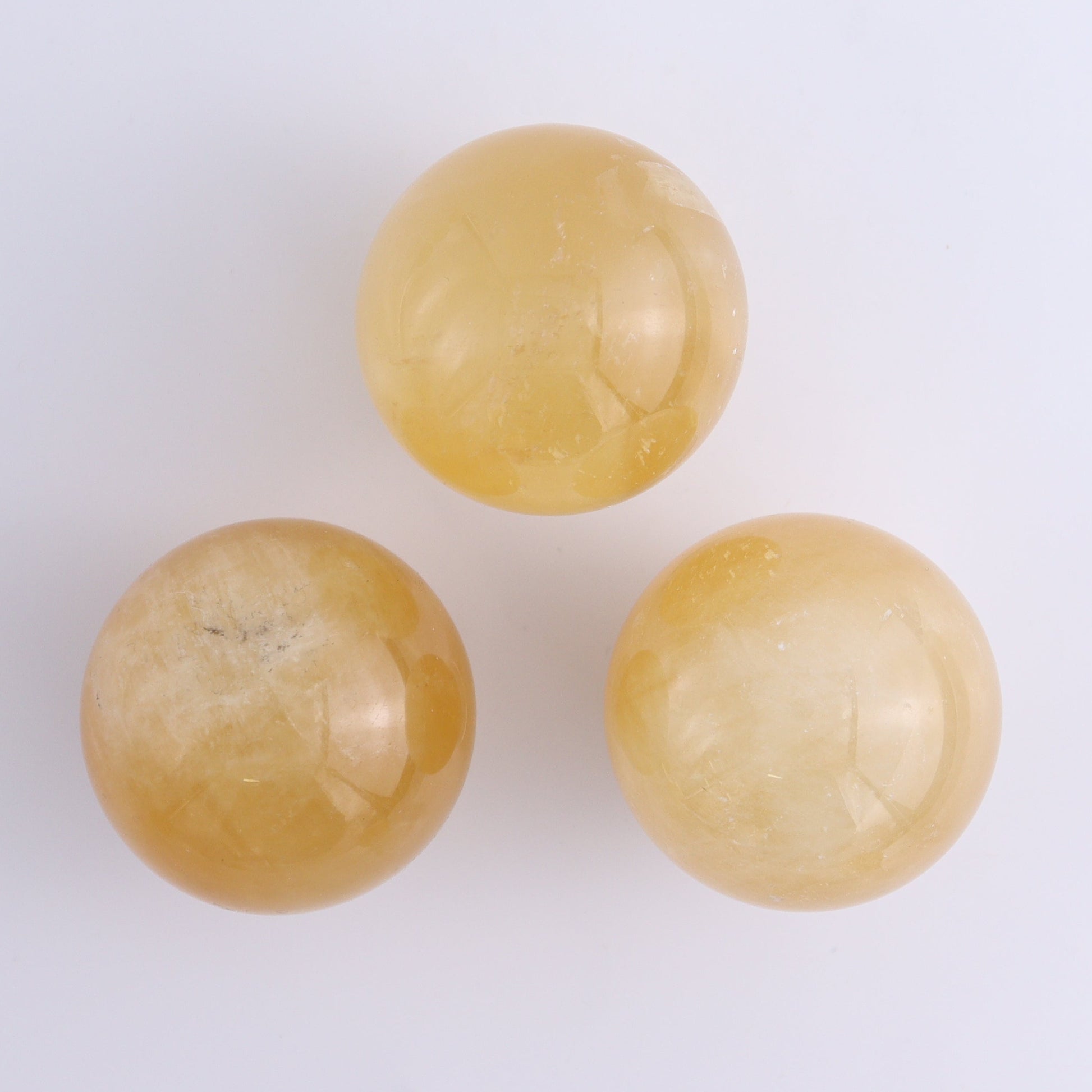 Calcite Spheres Set of 9 - Expert Wholesale and Supplier of Wholesale Crystals & Bulk Gemstones, ["Calcite","Mexico","Spheres"]